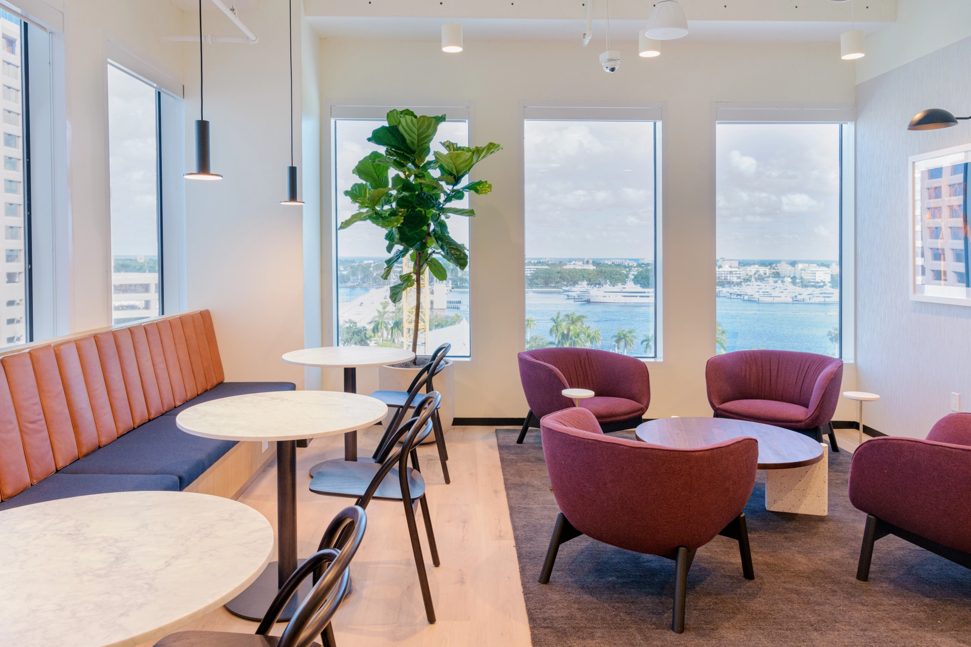 A workspace with a large window overlooking the water in West Palm Beach.