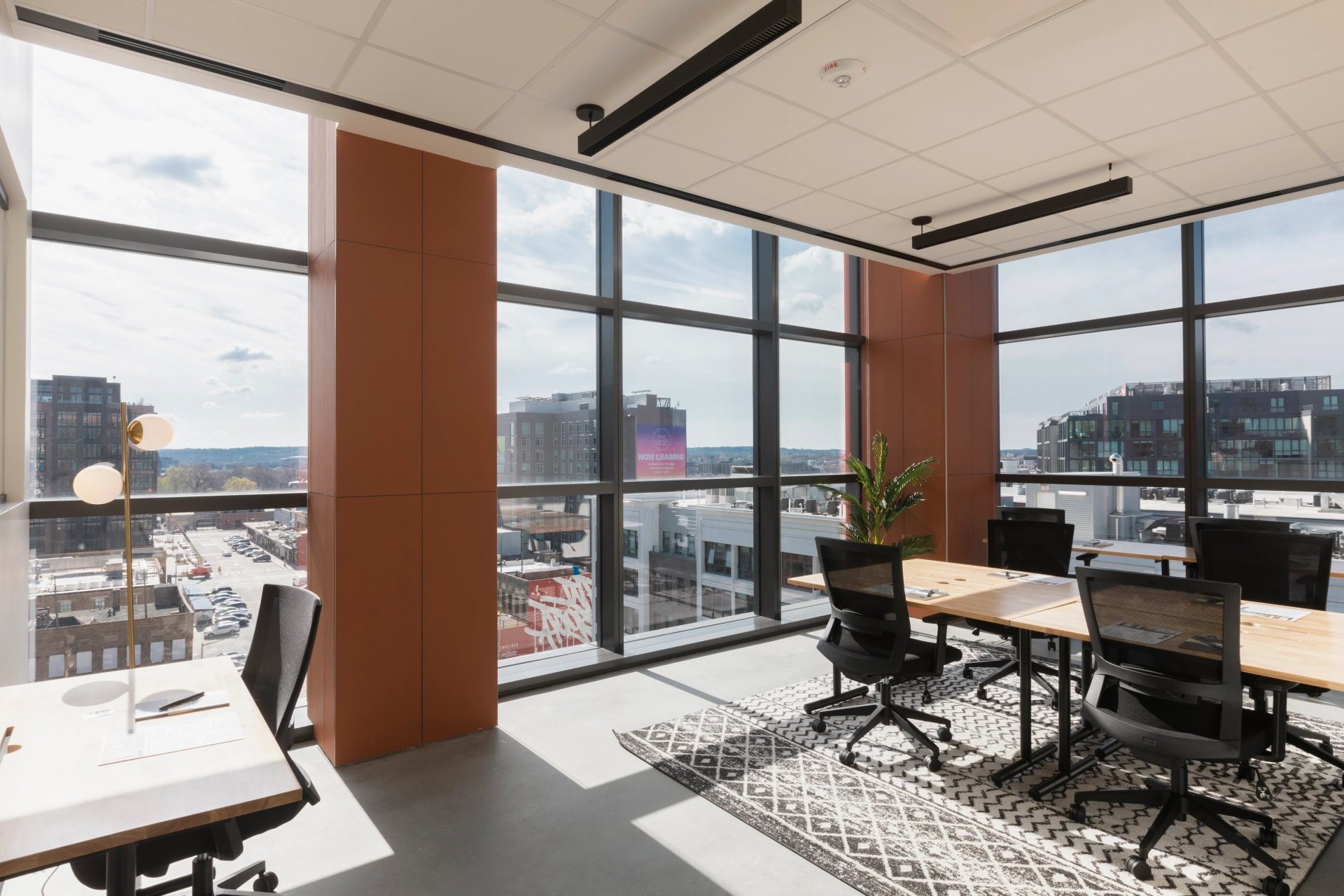 A Washington coworking office with large windows overlooking a city.