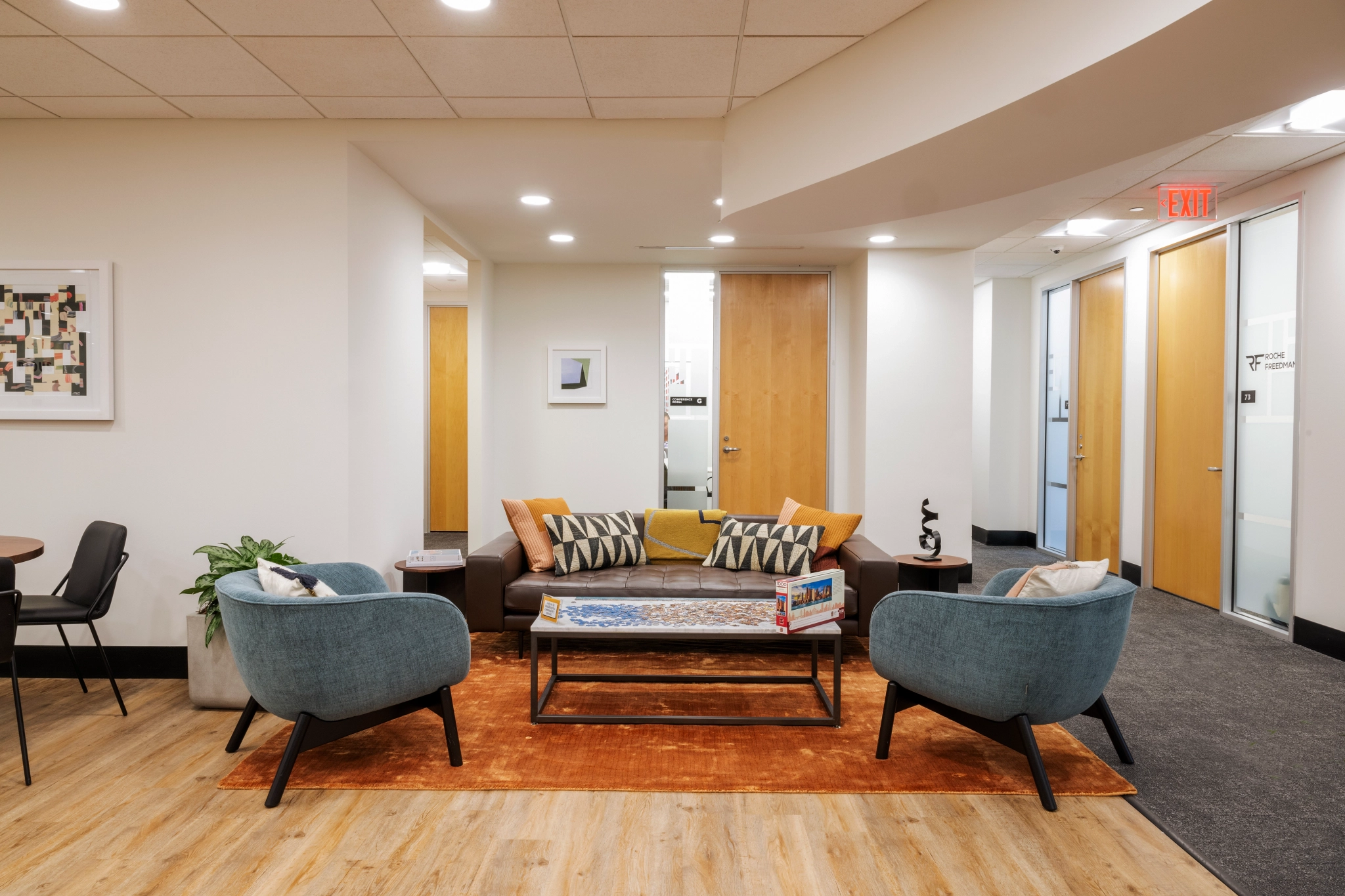 An office with couches, chairs and a coffee table located in Boston.