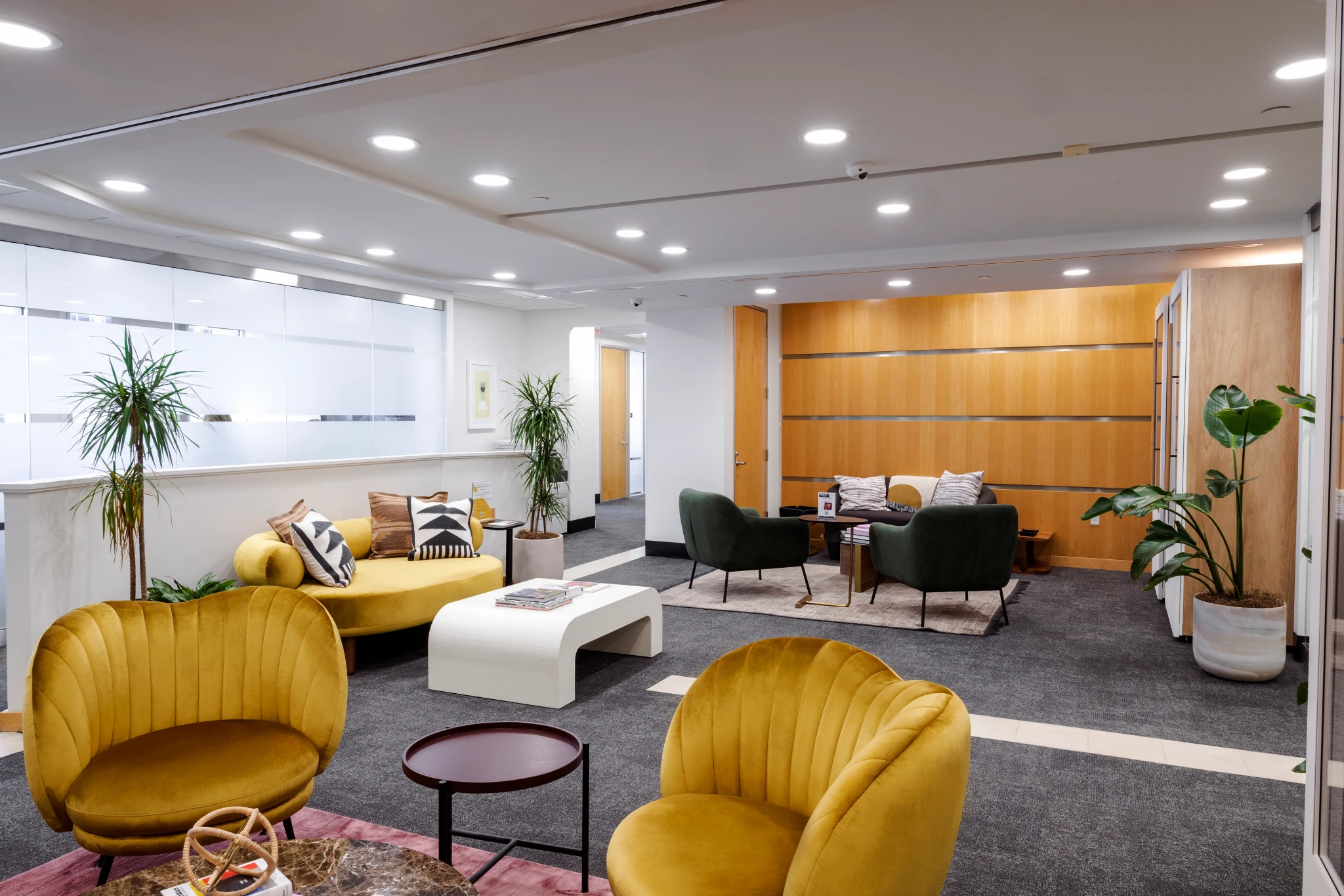 A coworking office in Boston featuring yellow couch and chairs.