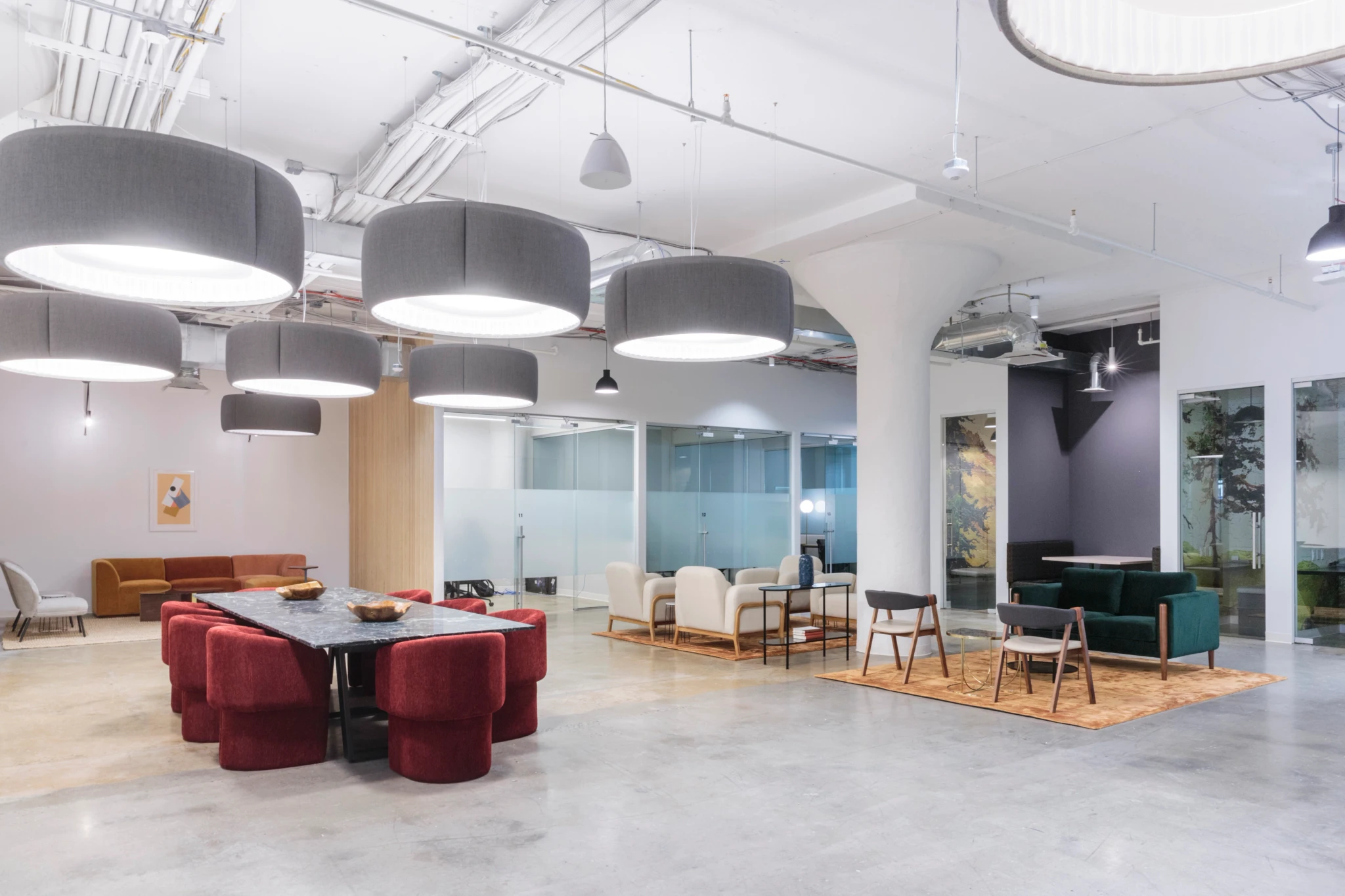 A modern coworking space in Brooklyn with a large table and chairs.