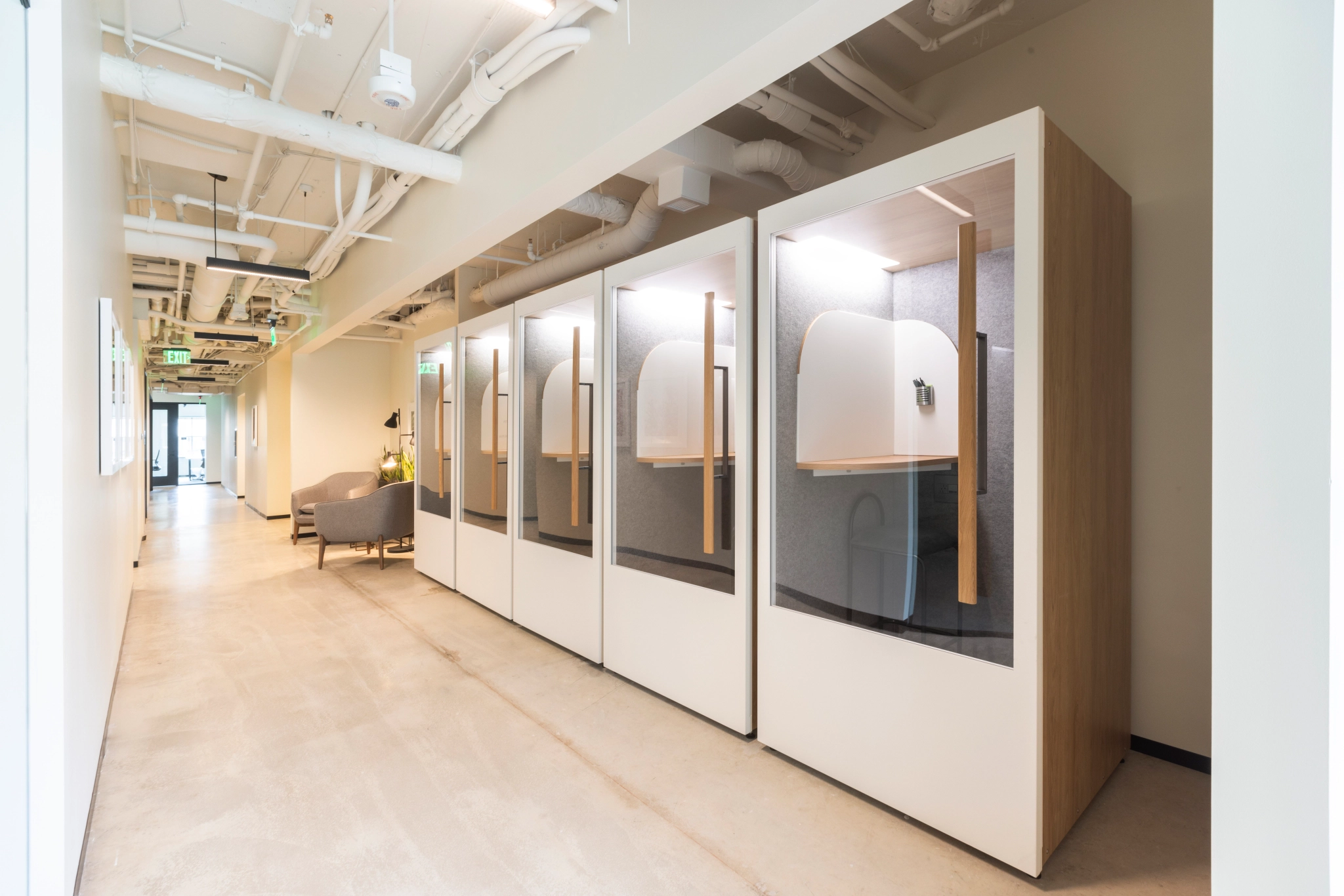 A long hallway with a row of white cabinets in a coworking office in Washington.