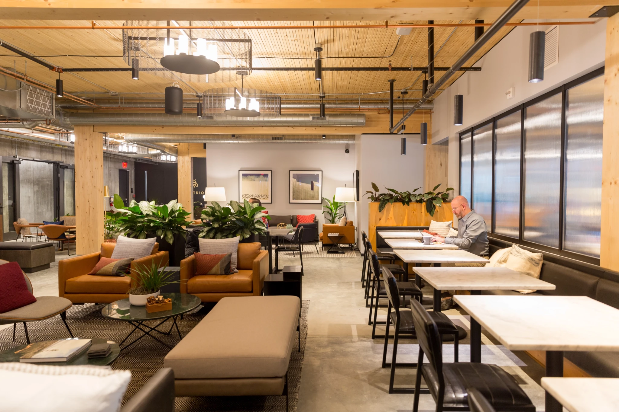 A person sitting at a coworking table in a Minneapolis office.