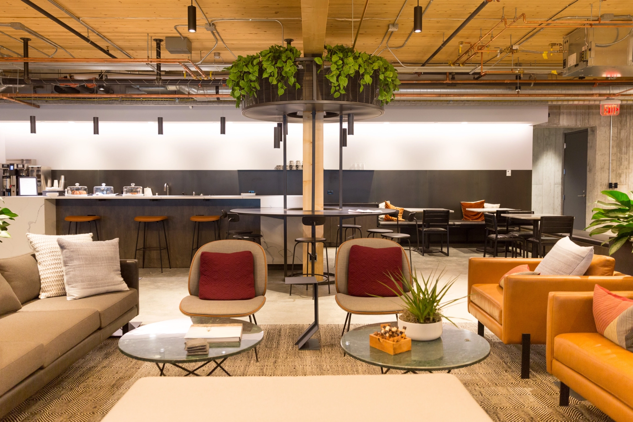 a coworking space with couches and a coffee table