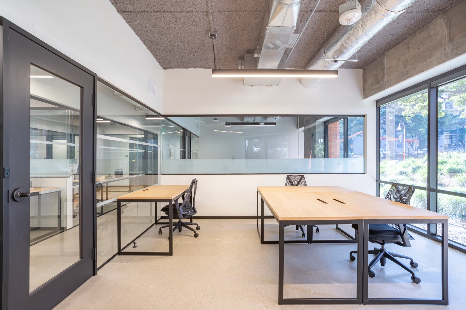 A meeting room in a San Francisco office with a desk and chairs.