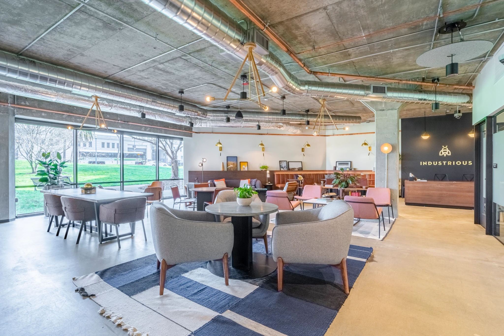 a modern coworking space in San Francisco with tables, chairs, and meeting room facilities.