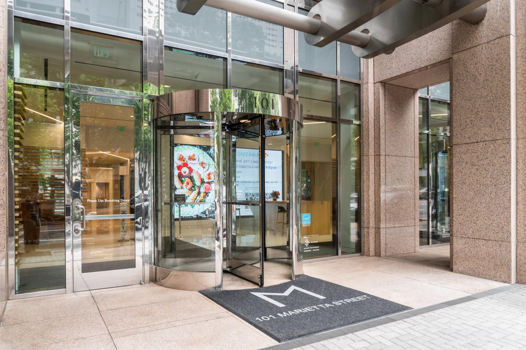 The office entrance in Atlanta features a glass door.