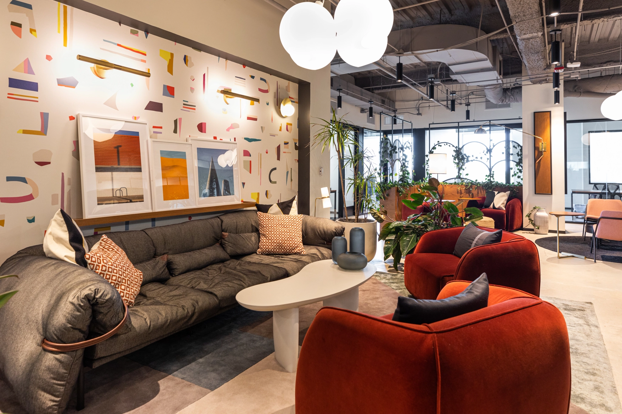 A coworking space in Evanston featuring couches, chairs, and a coffee table.