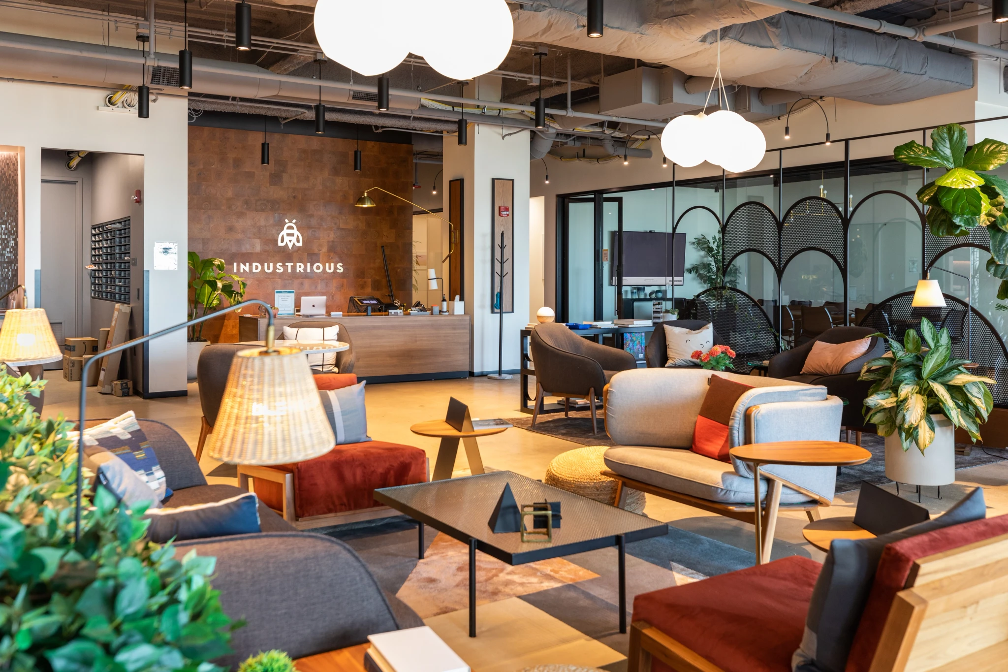 A modern office lobby in Evanston, adorned with abundant furniture and plants.