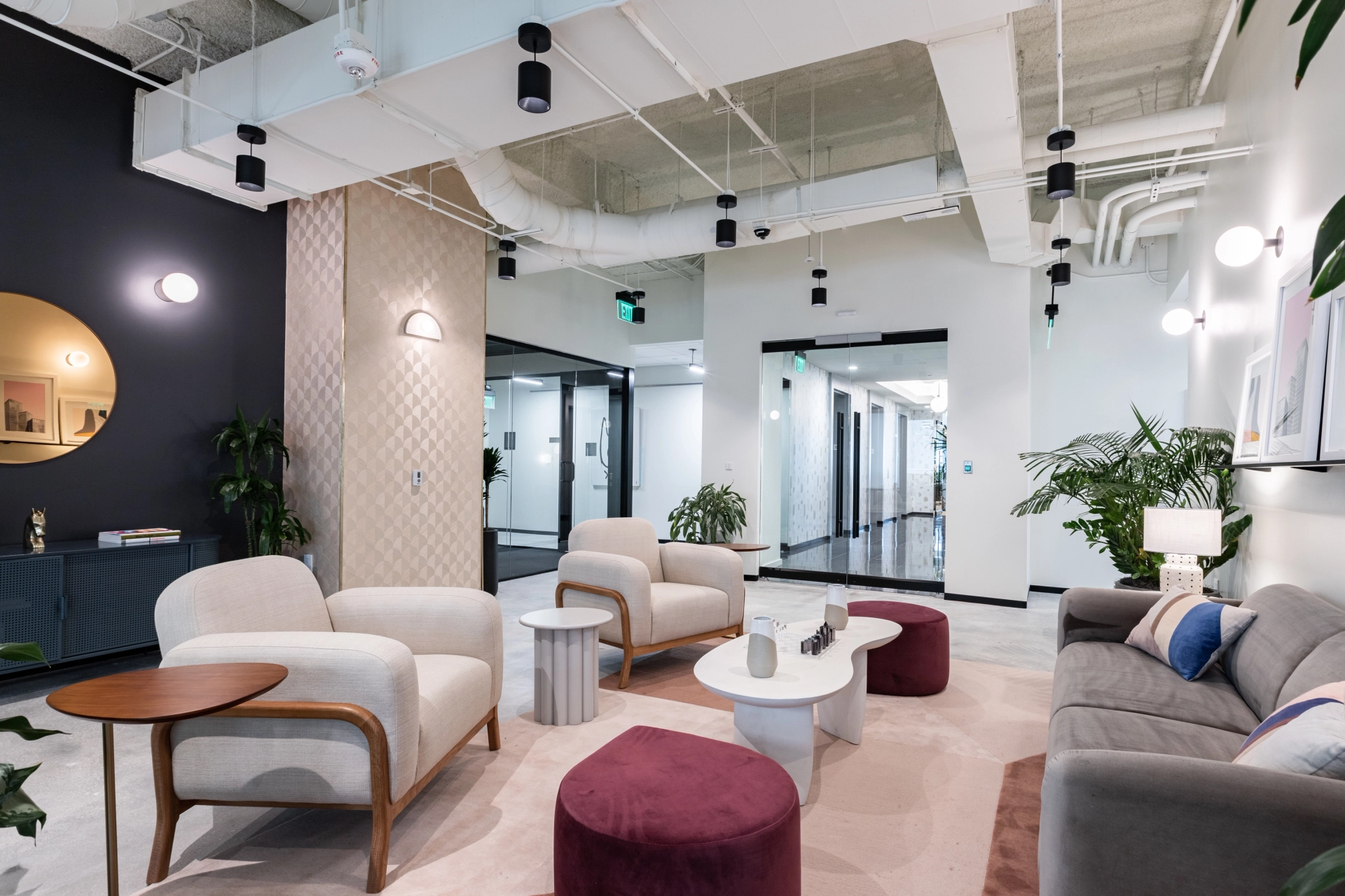 A coworking office with modern furniture including couches and chairs, located in Miami.