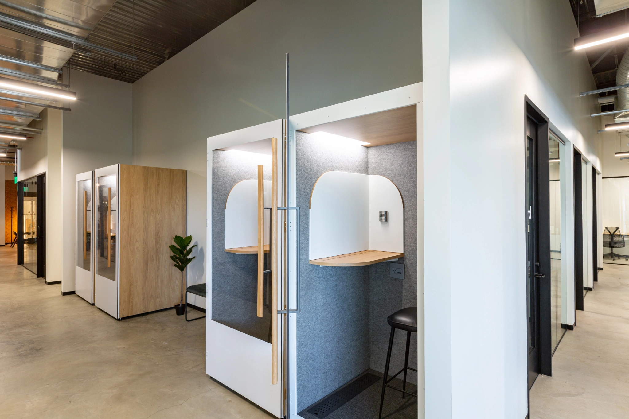 A coworking space in Walnut Creek offering a compact workspace with a few booths.