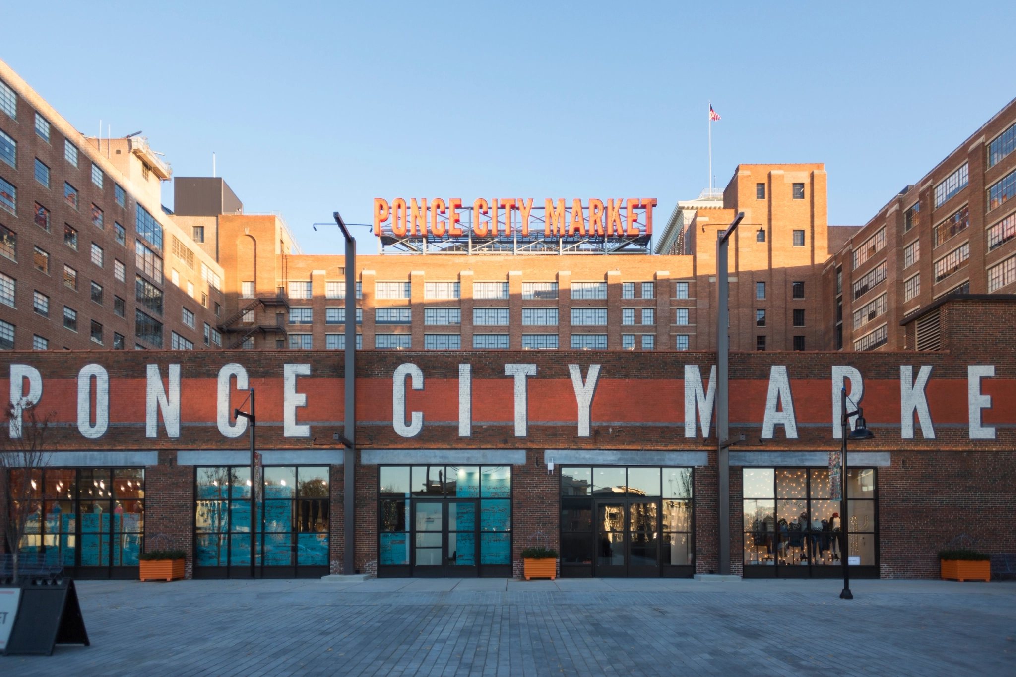 A workspace located in Atlanta's Ponce City Market, housed within a brick building with a prominent sign.