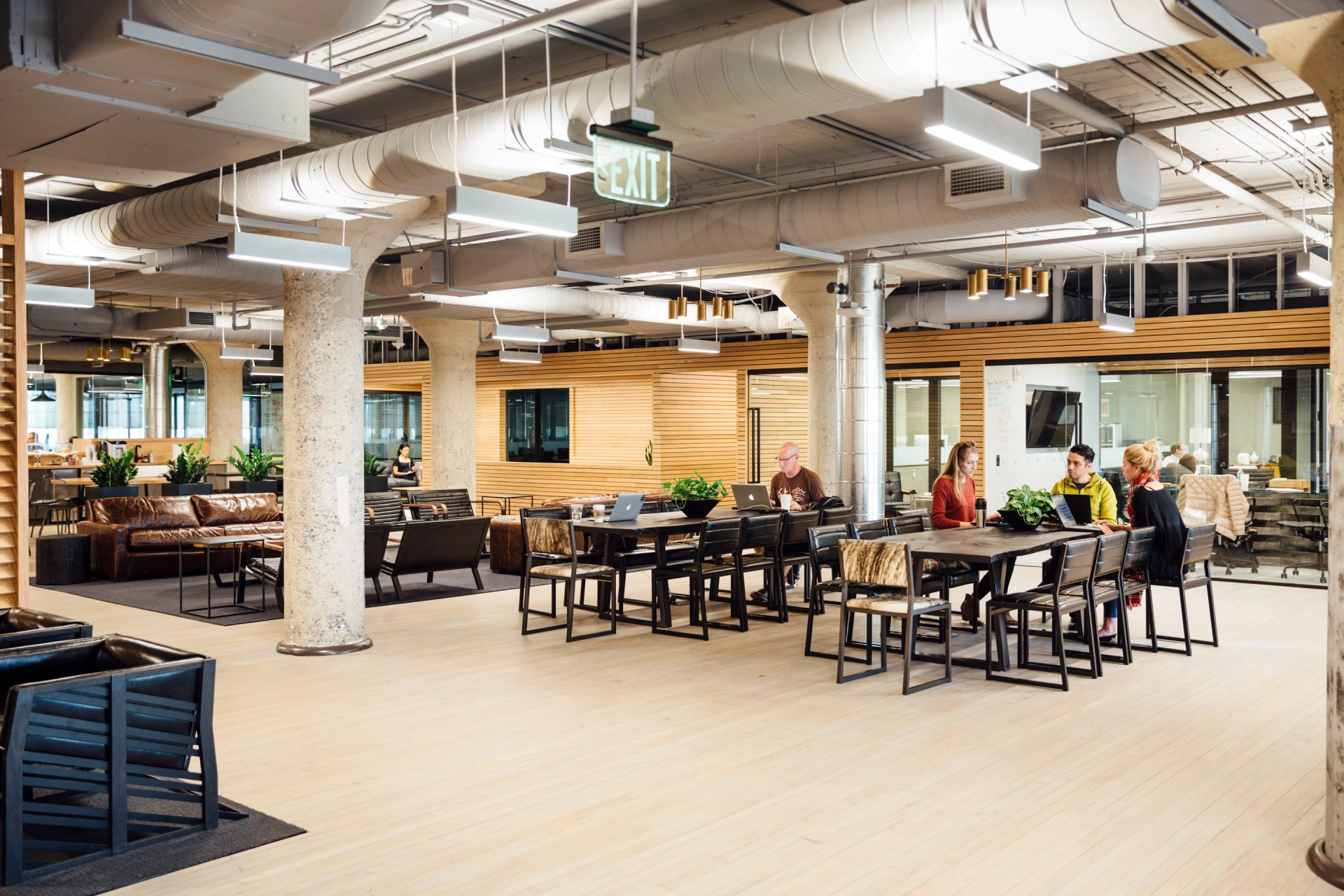 A coworking space in Atlanta outfitted with tables and chairs, resembling a large open office.