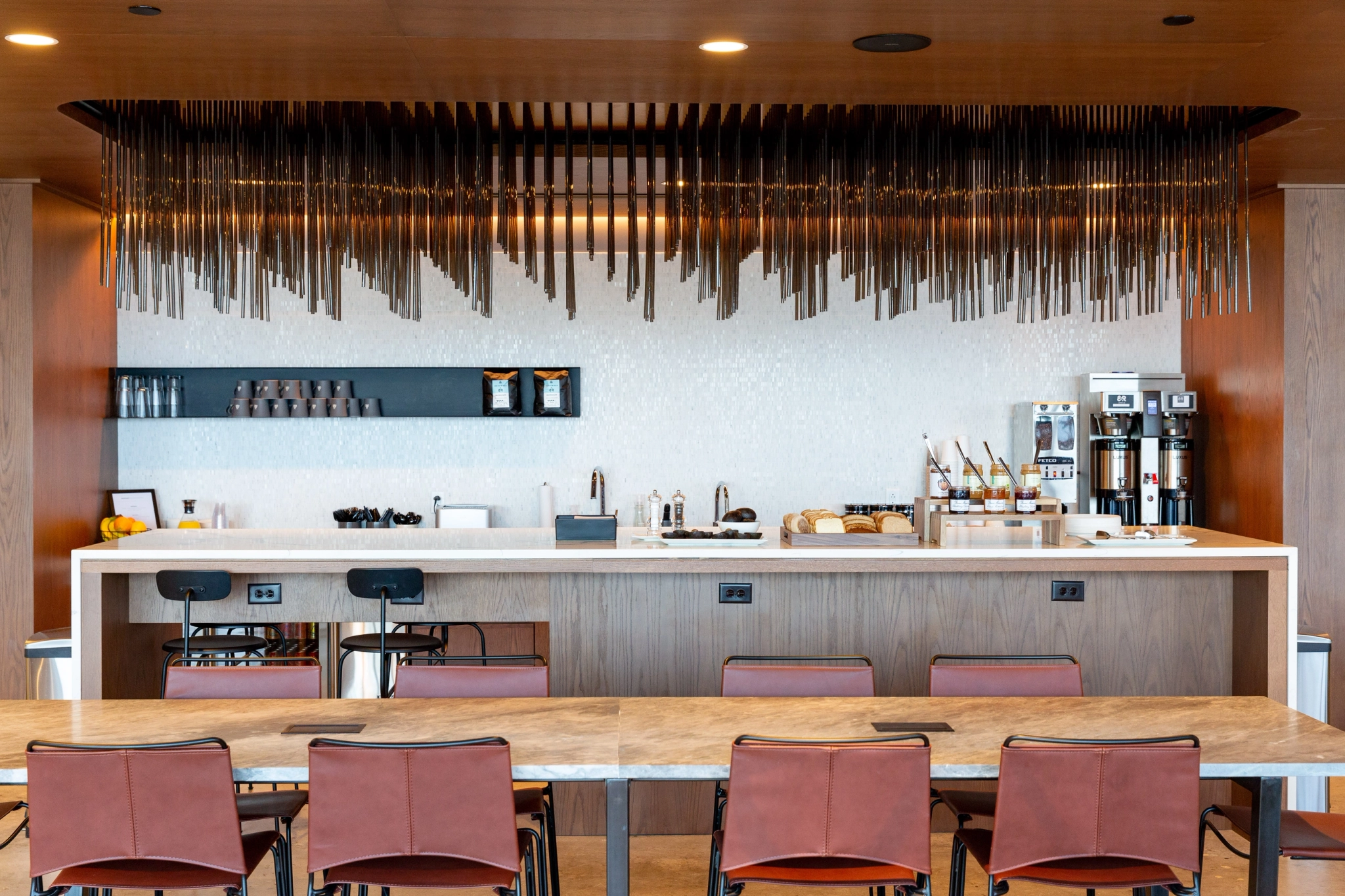 a workspace with wooden chairs.