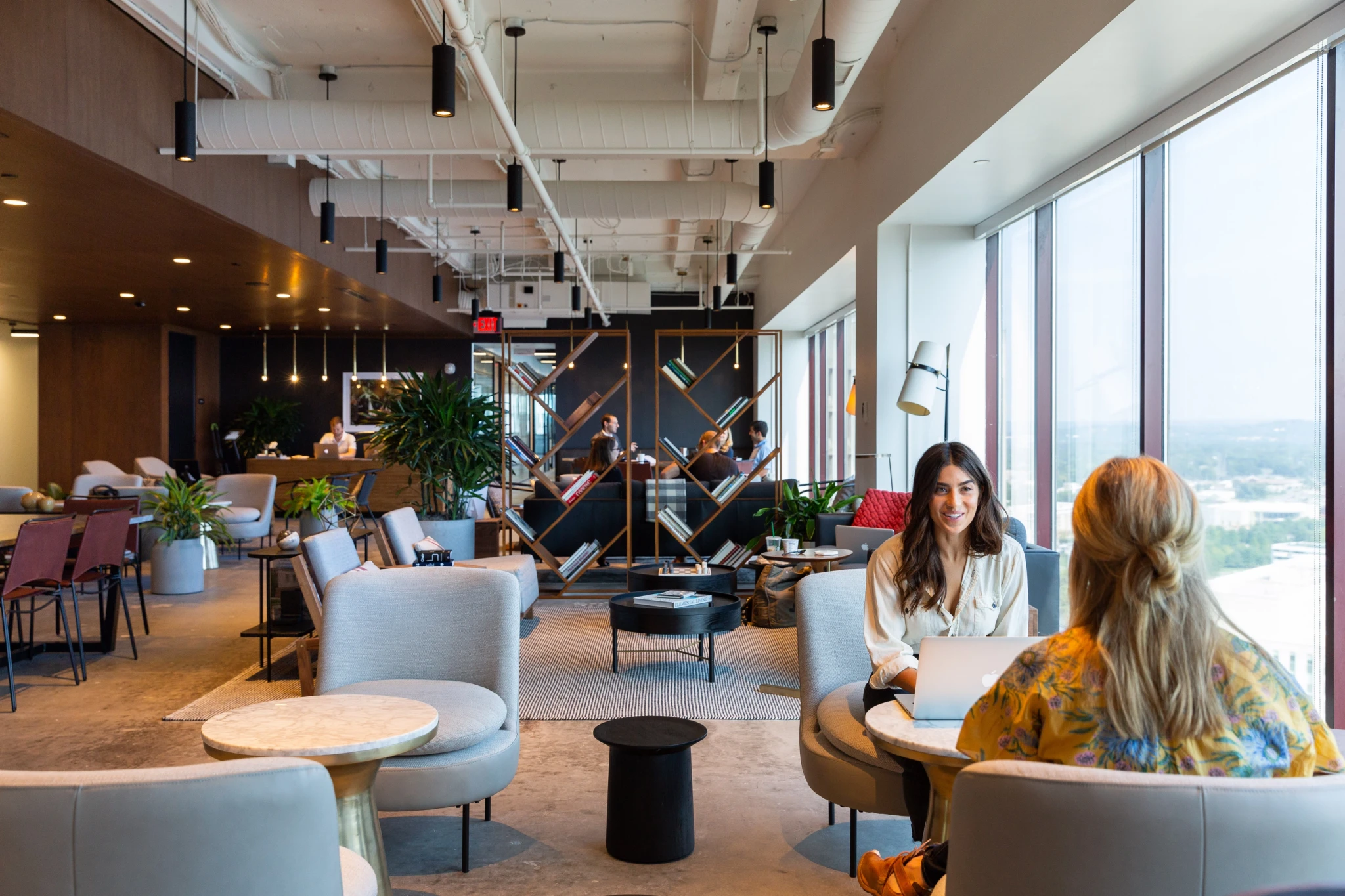 A group of people sitting in chairs in a Nashville coworking office.