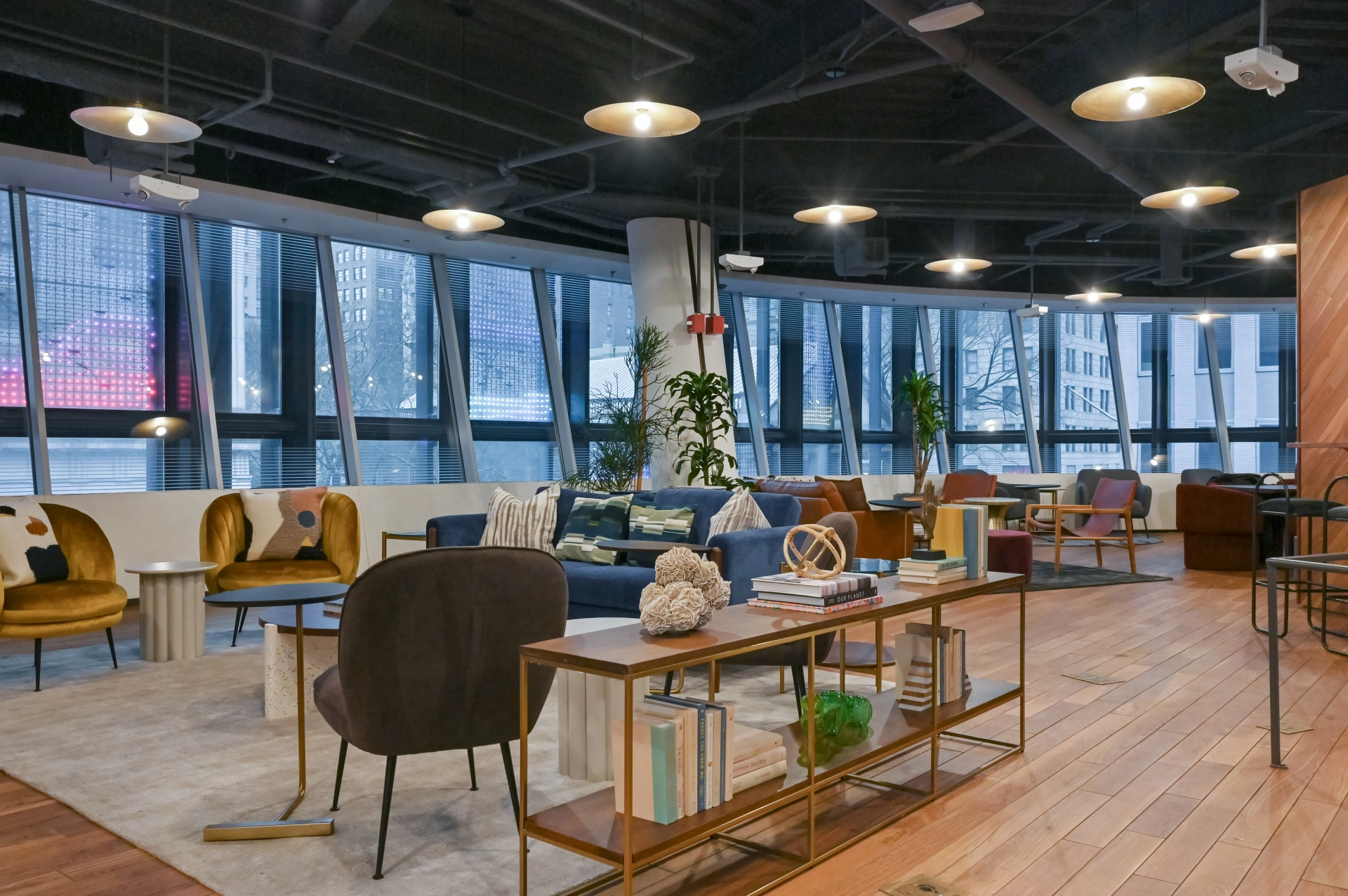 A modern New York office with a view of the city and wooden floors.