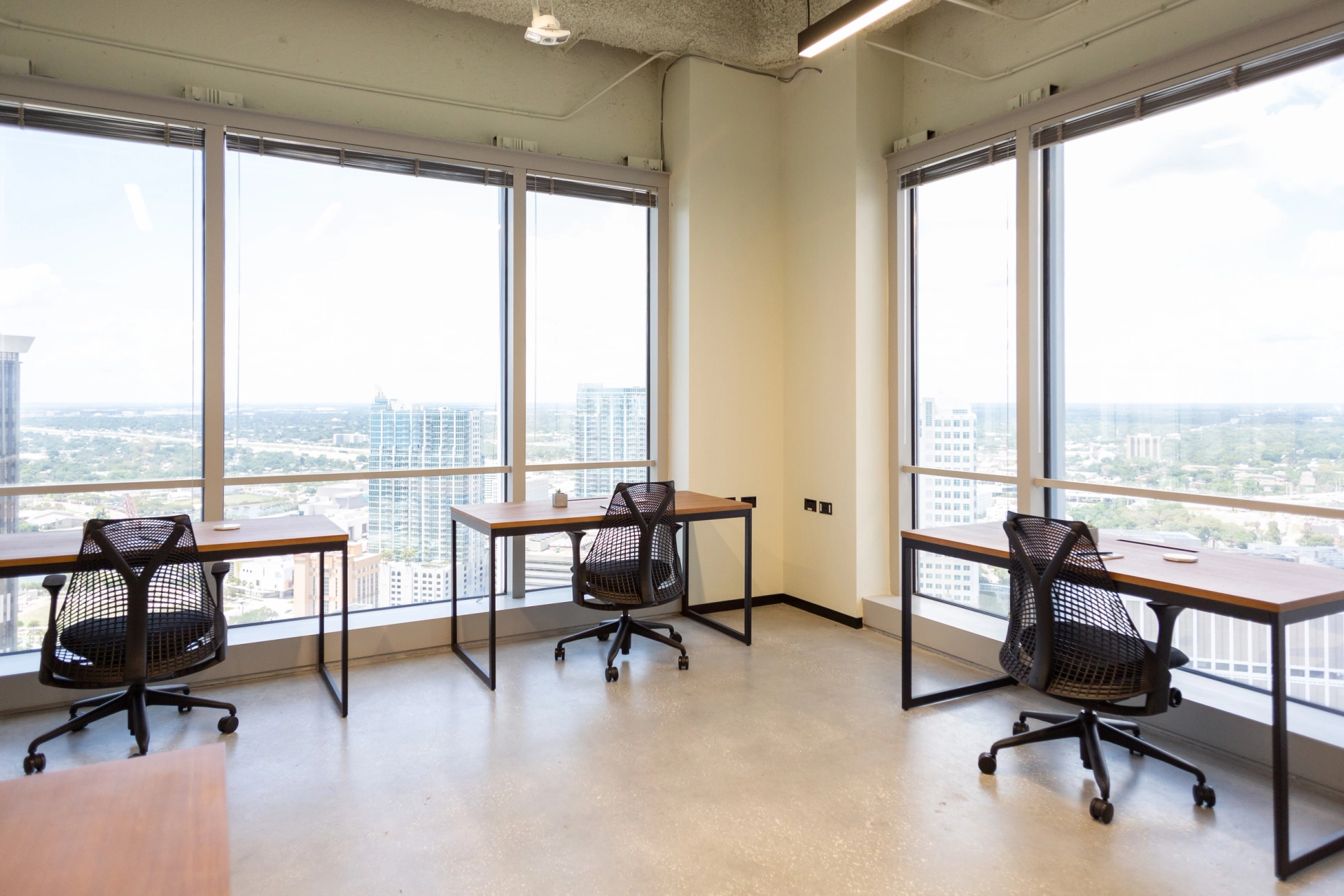 An office workspace with a view of the city.