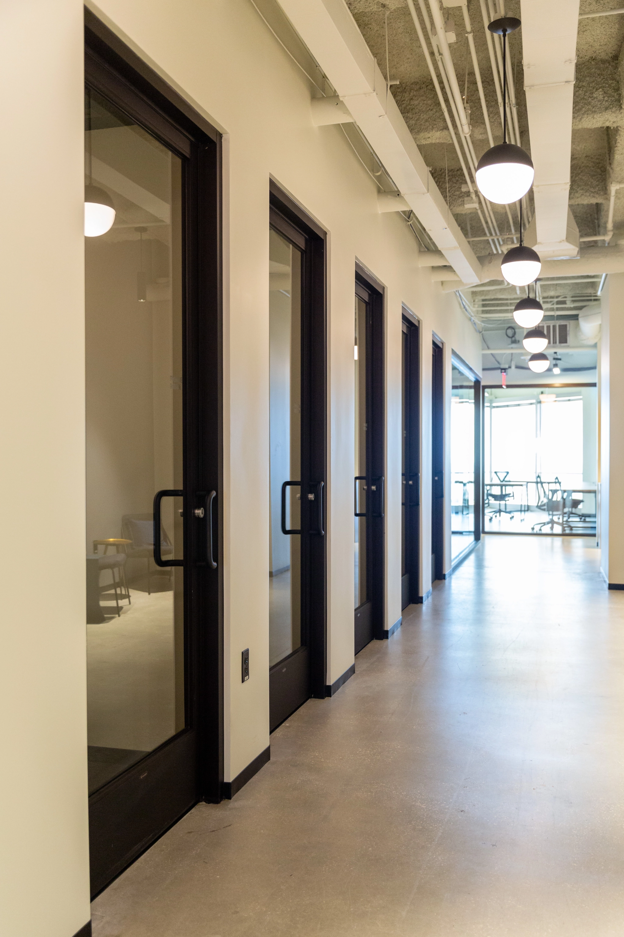 An office hallway in Tampa featuring glass doors.