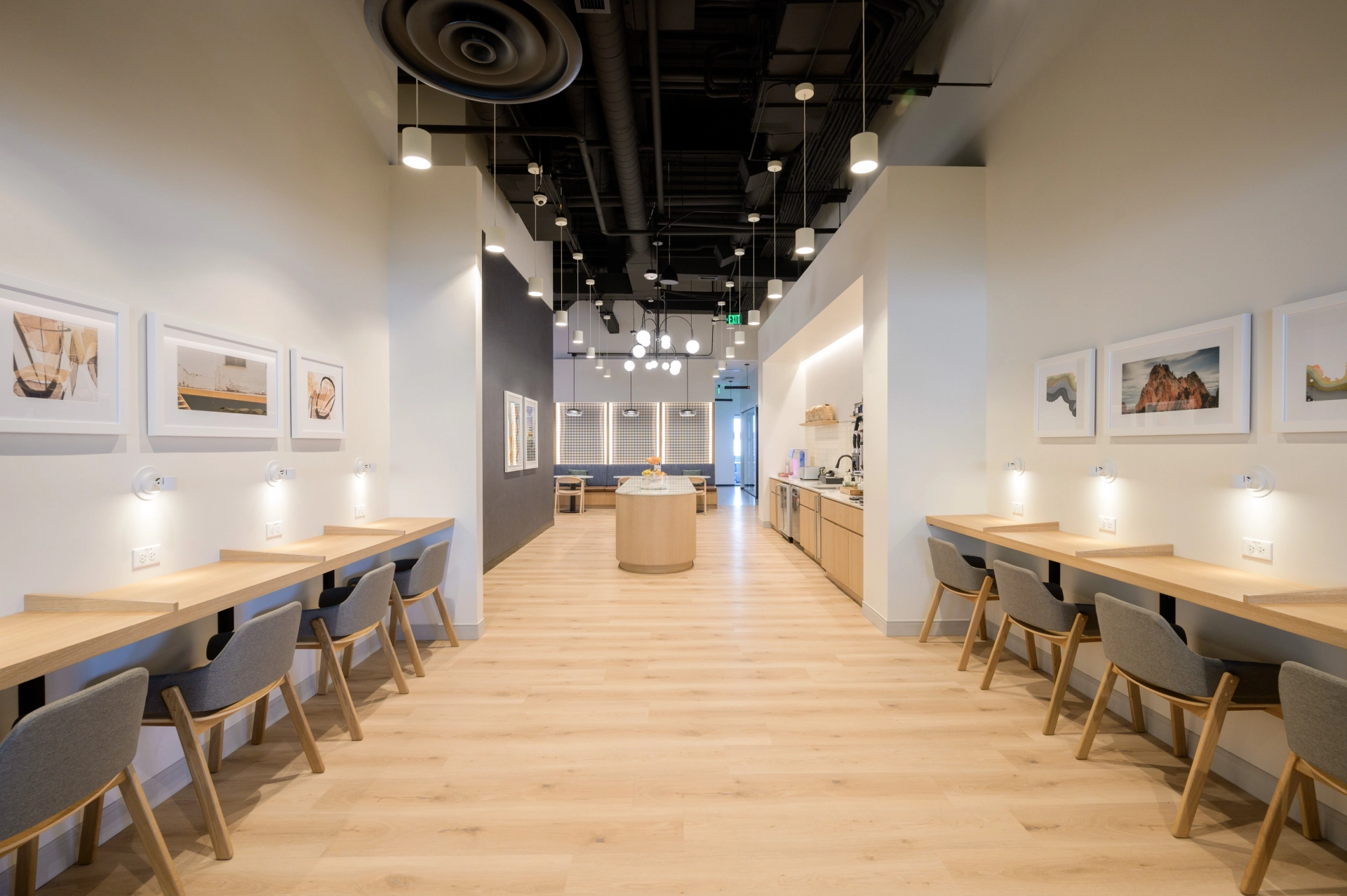 A long line of tables and chairs in a Denver coworking space.