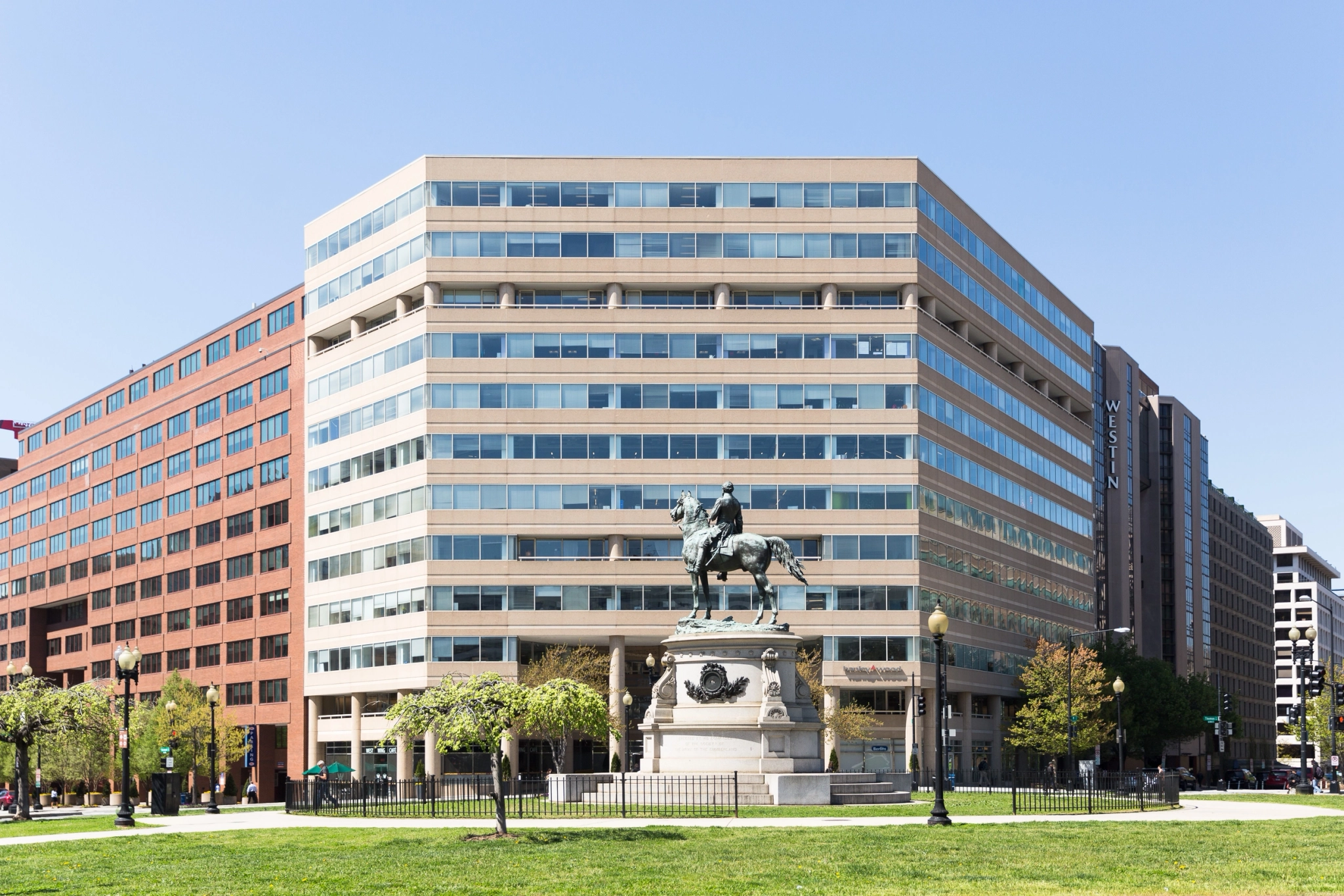 A coworking office space located in a building featuring a statue of a horse.