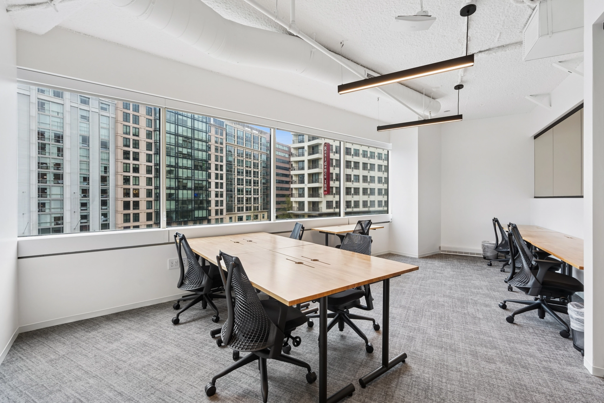 a large, bright meeting room with a large screen