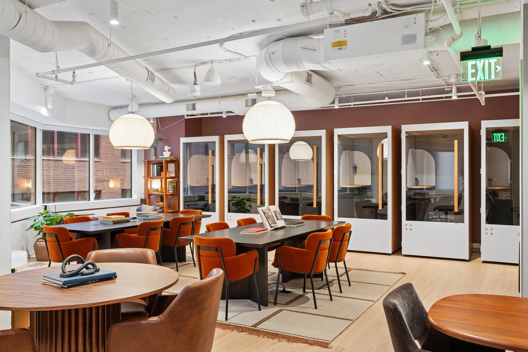 a large, bright meeting room with a large screen