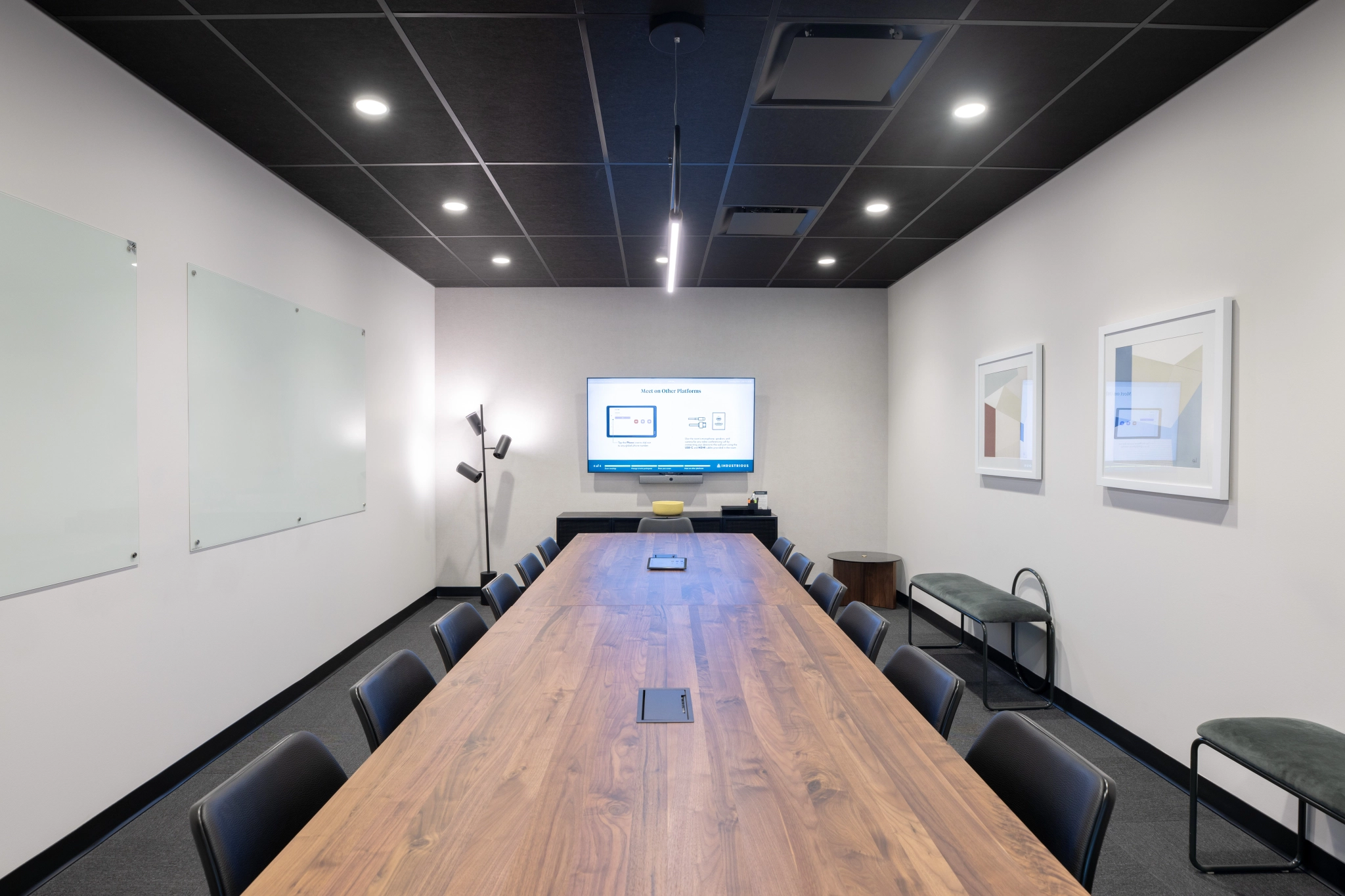 A Houston meeting room with a wooden table and chairs.