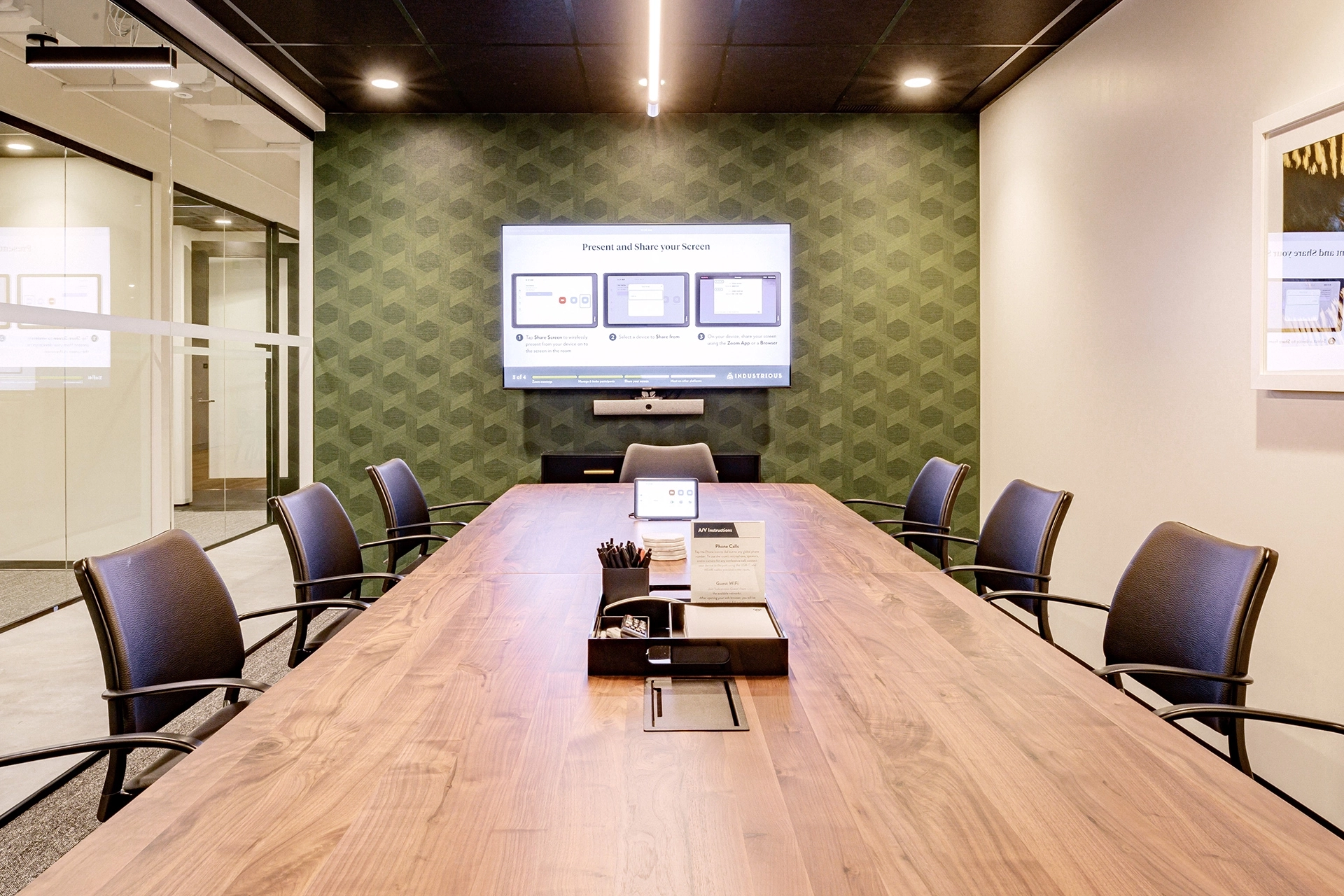 A coworking office space in Toronto featuring a spacious conference room with a large table and chairs.