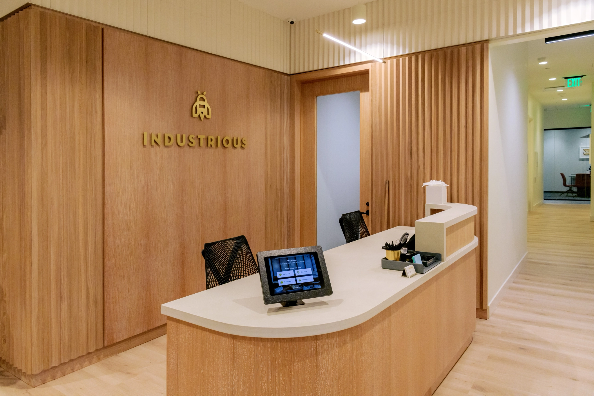 A coworking workspace in the reception area of a medical office in Hallandale Beach.