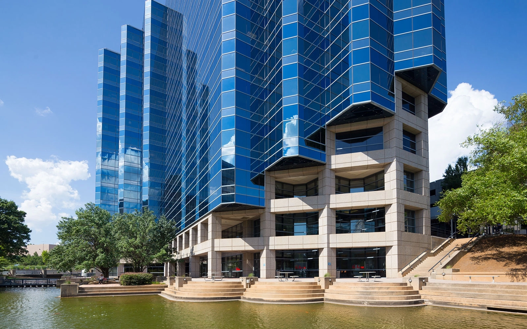 A coworking office with meeting rooms situated next to a waterfront.