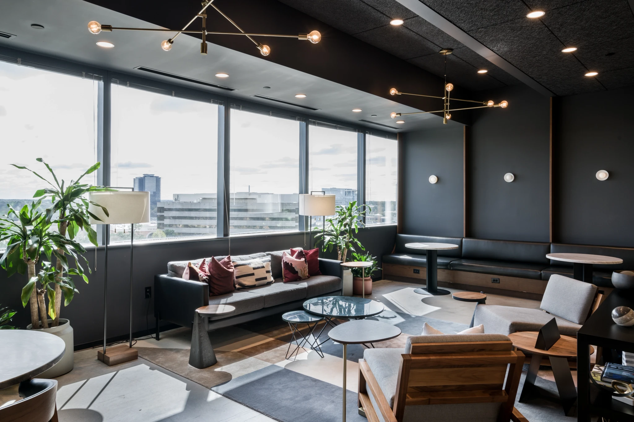 A black and white meeting room with a view of Atlanta's cityscape.