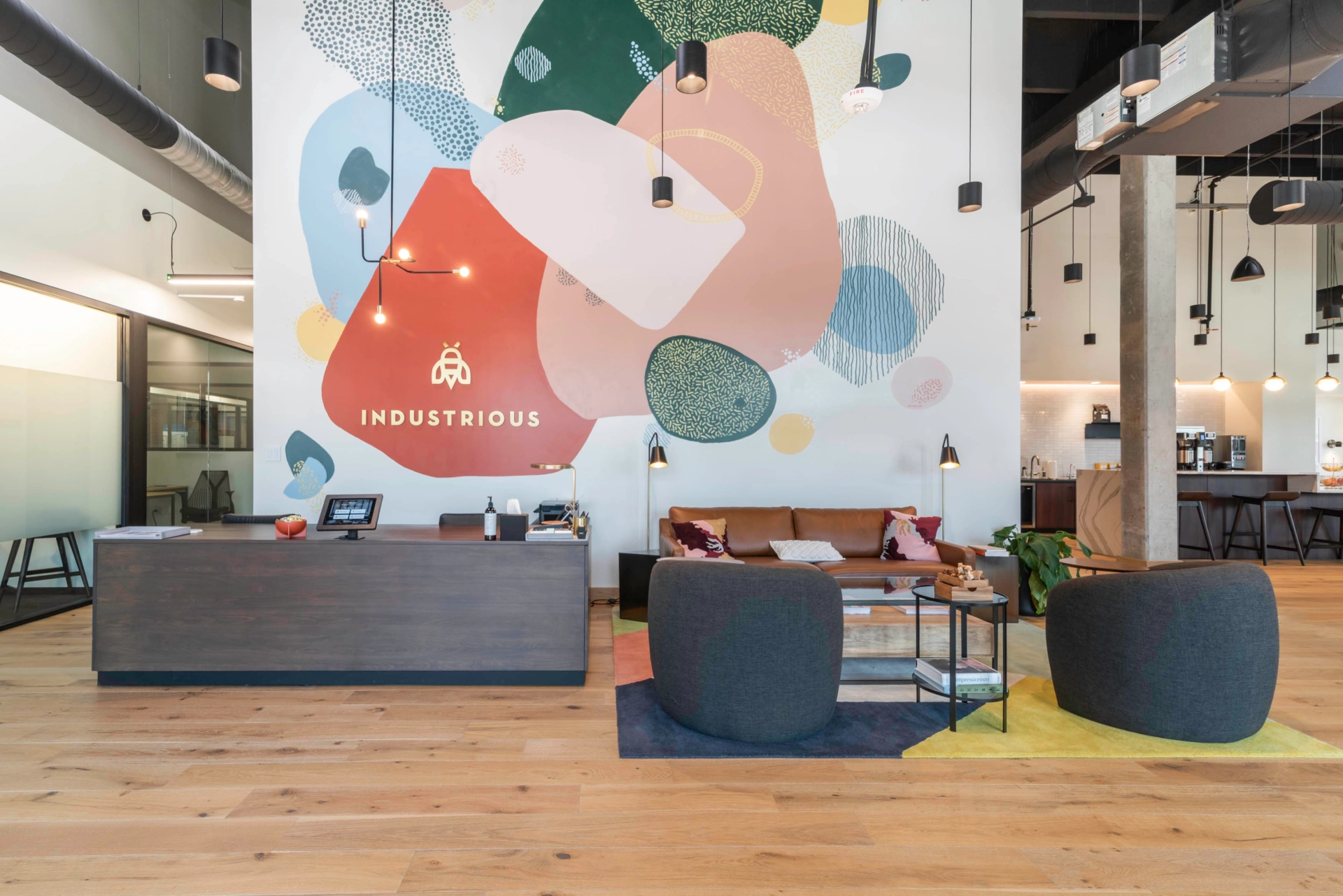 An office in Charlotte with a vibrant mural on the wall.