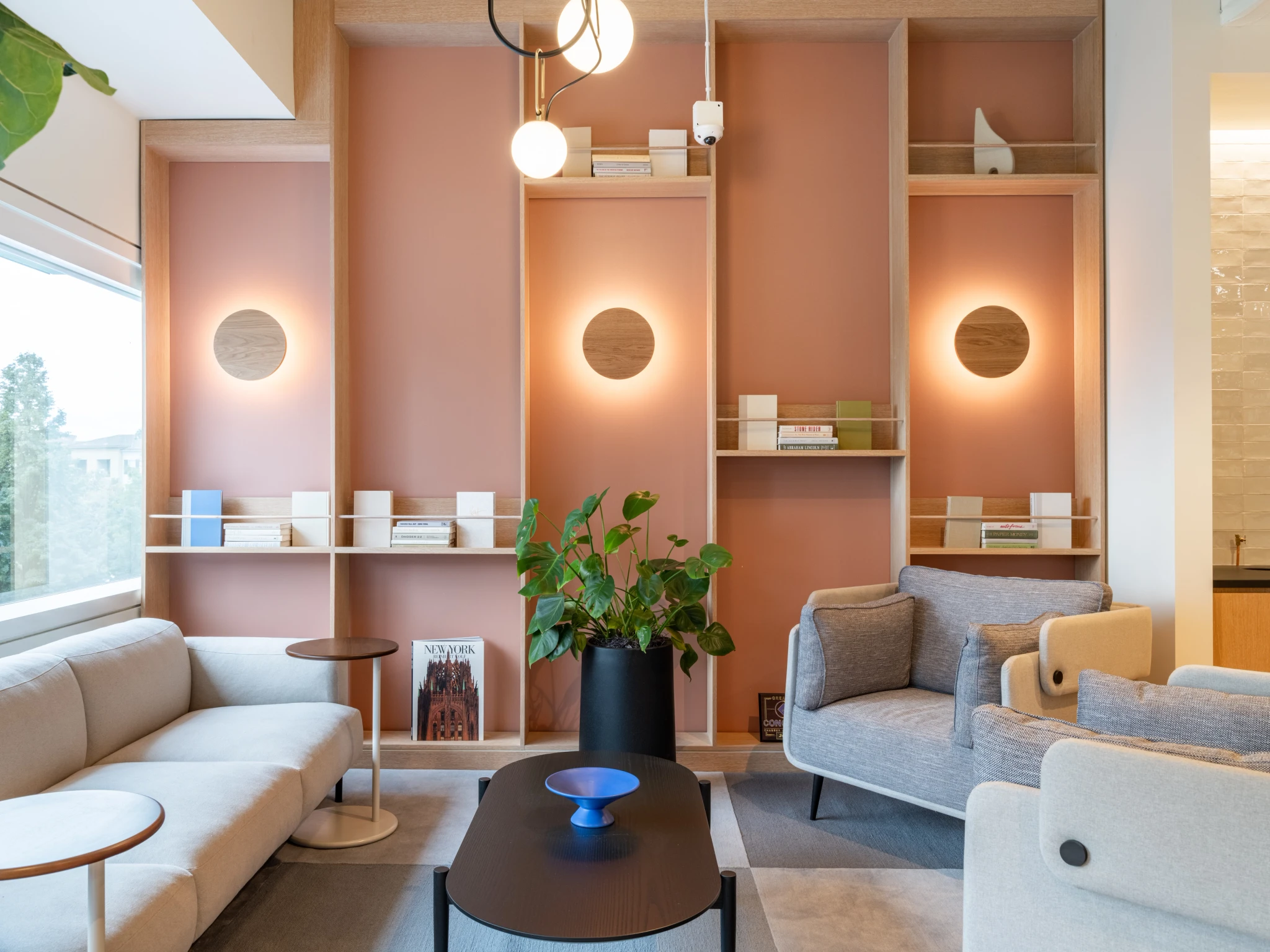a pink living room with a coffee table.
