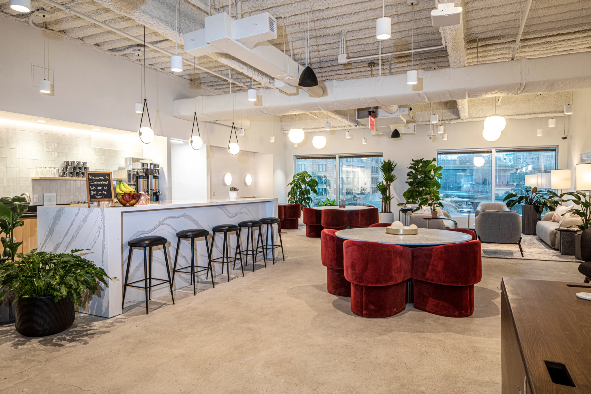 A modern coworking space with a bar for informal meetings.