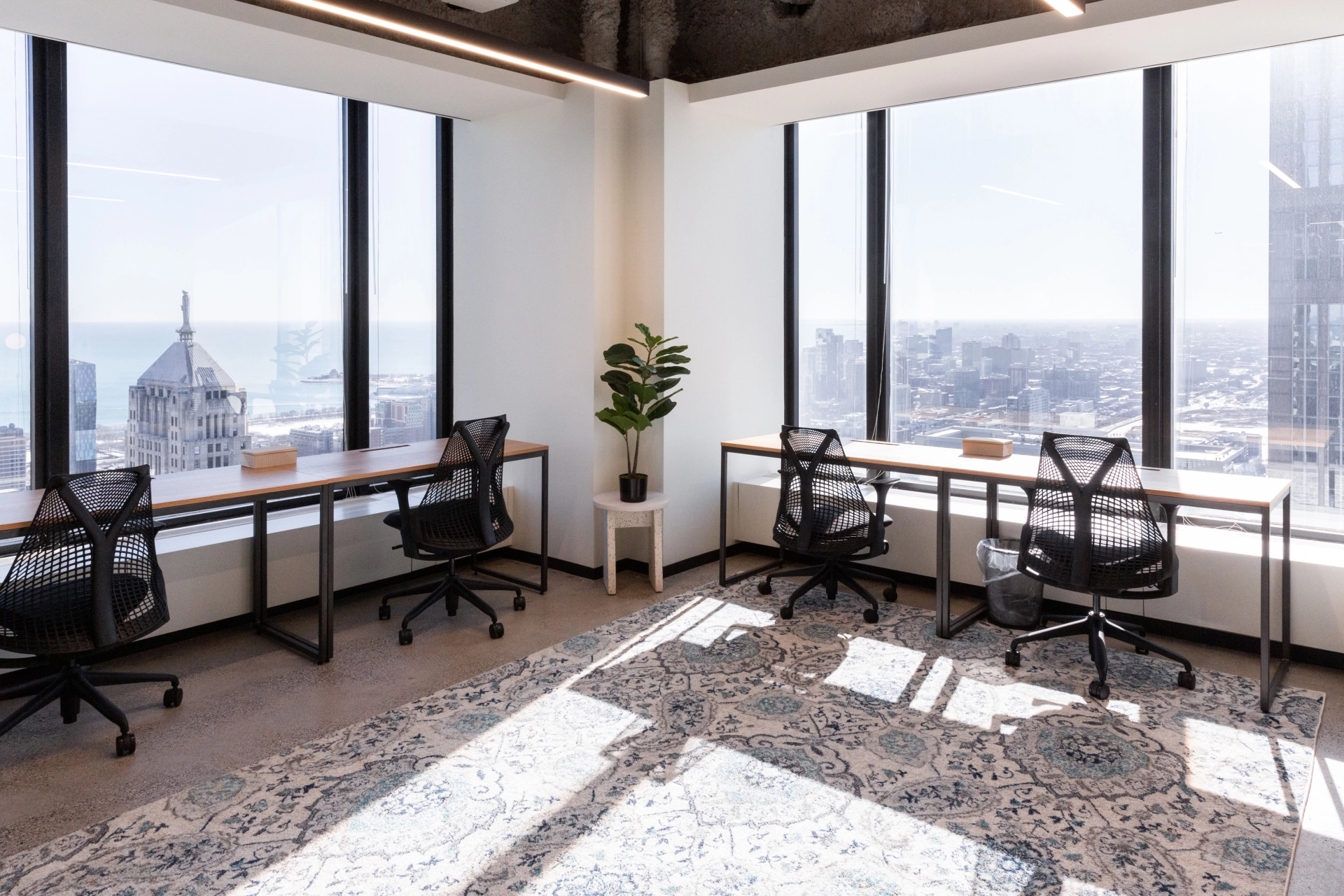 A Chicago office with spacious windows providing a scenic city view for an ideal workspace environment.