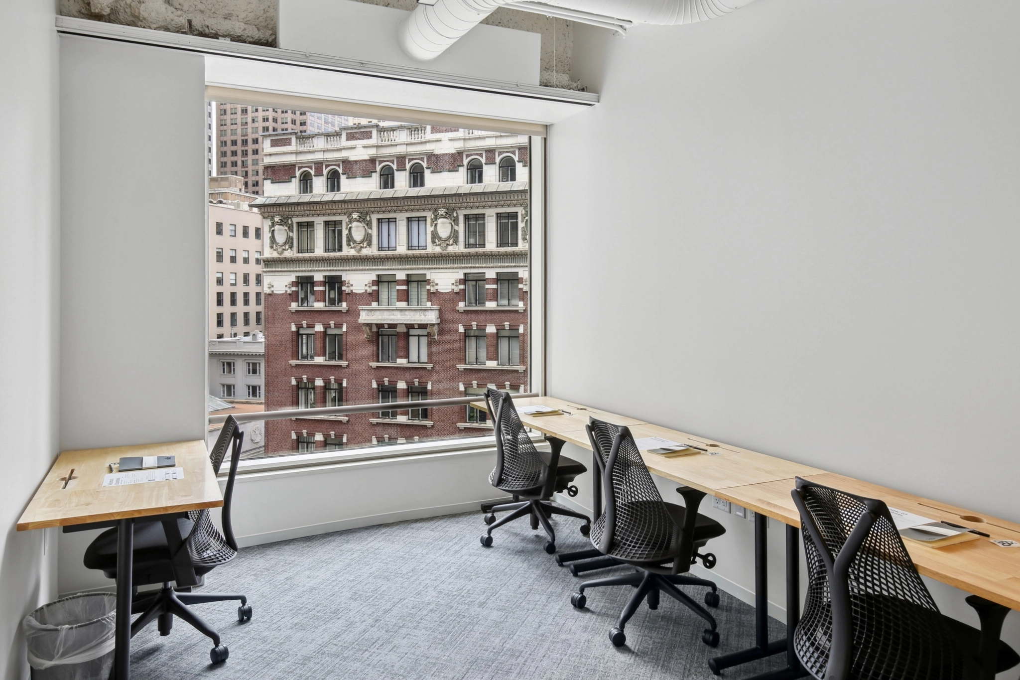 a large, bright meeting room with a large screen