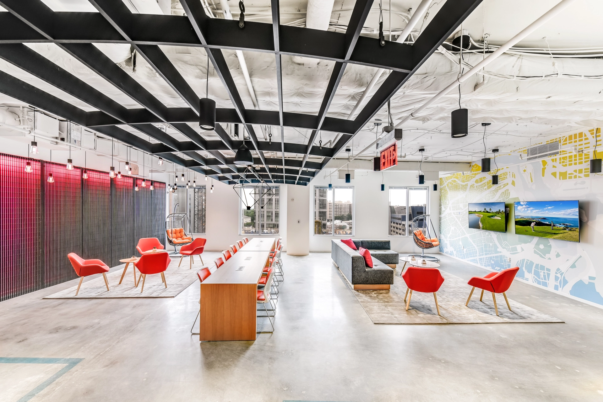 A modern Arlington office with colorful chairs and tables for coworking.