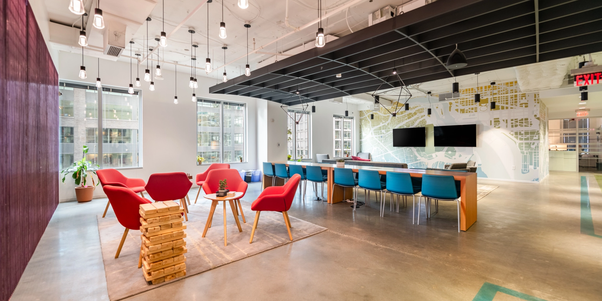 A modern Arlington office with colorful chairs and tables for coworking.