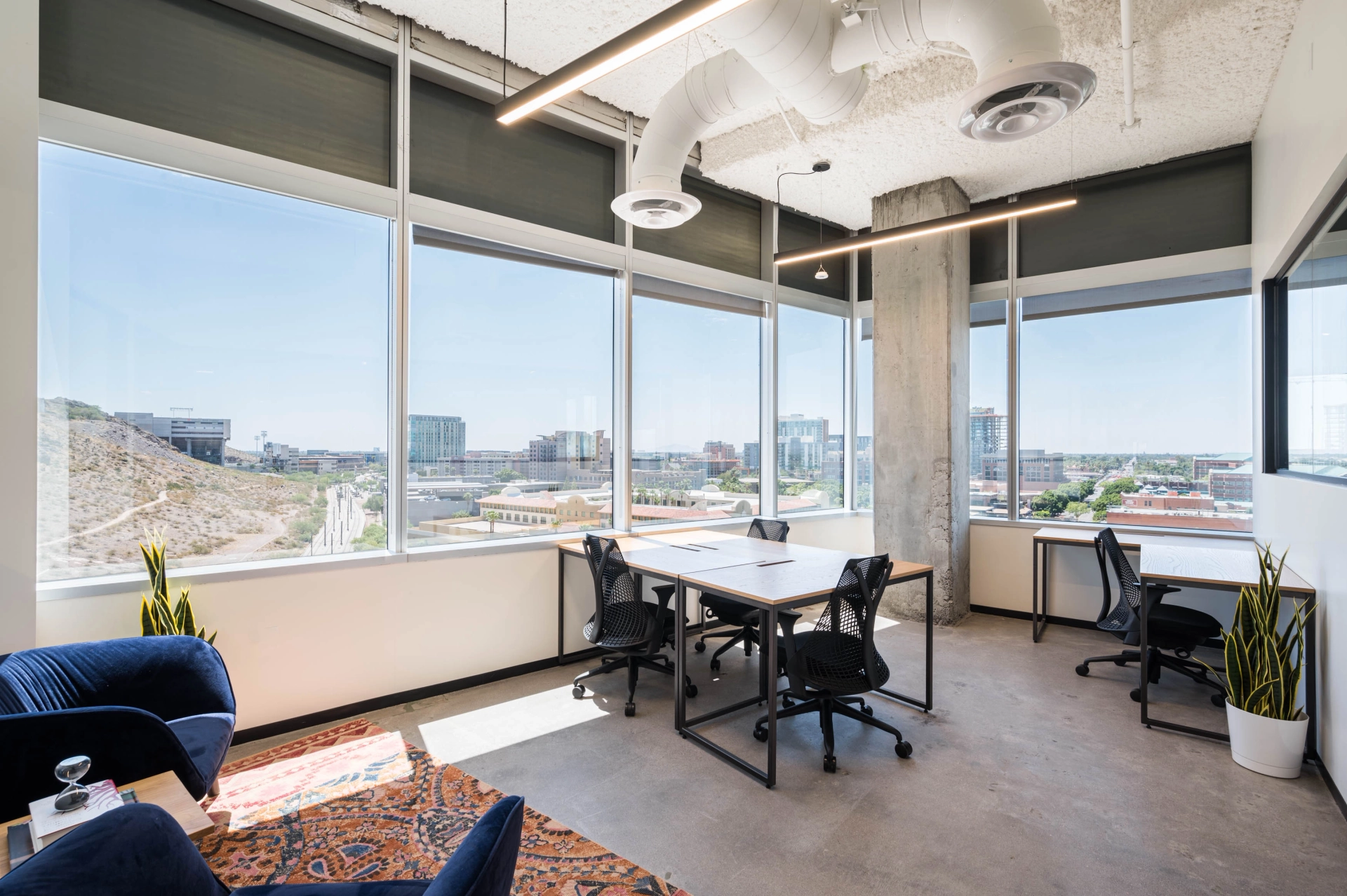 An office in Tempe with large windows overlooking the city.