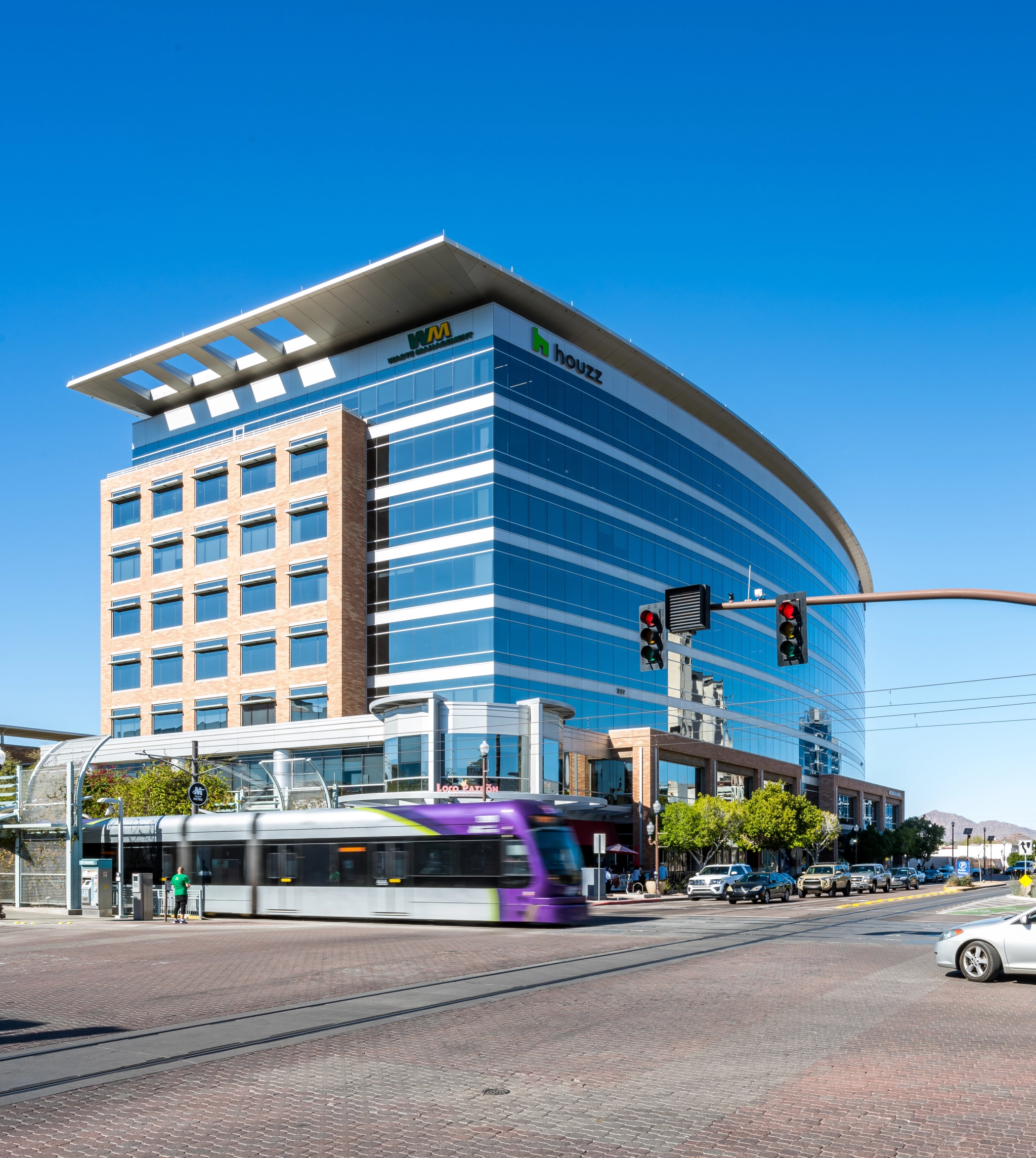 A workspace building situated in the city of Tempe, with a view of a bustling street.