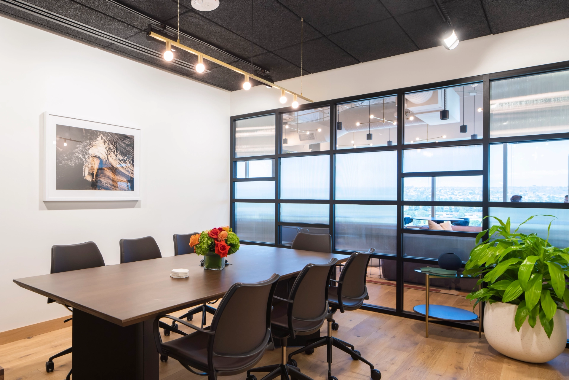 A coworking office in Los Angeles equipped with a table and chairs for conferences.