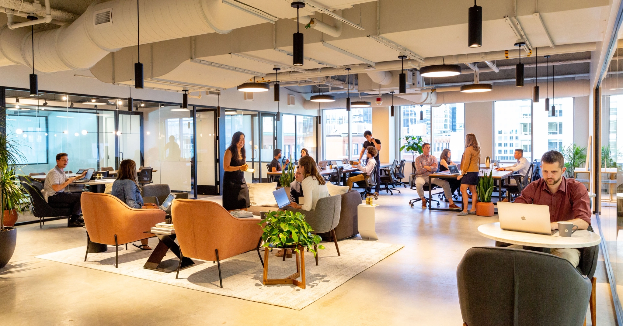 A coworking space where office workers collaborate in an open workspace.