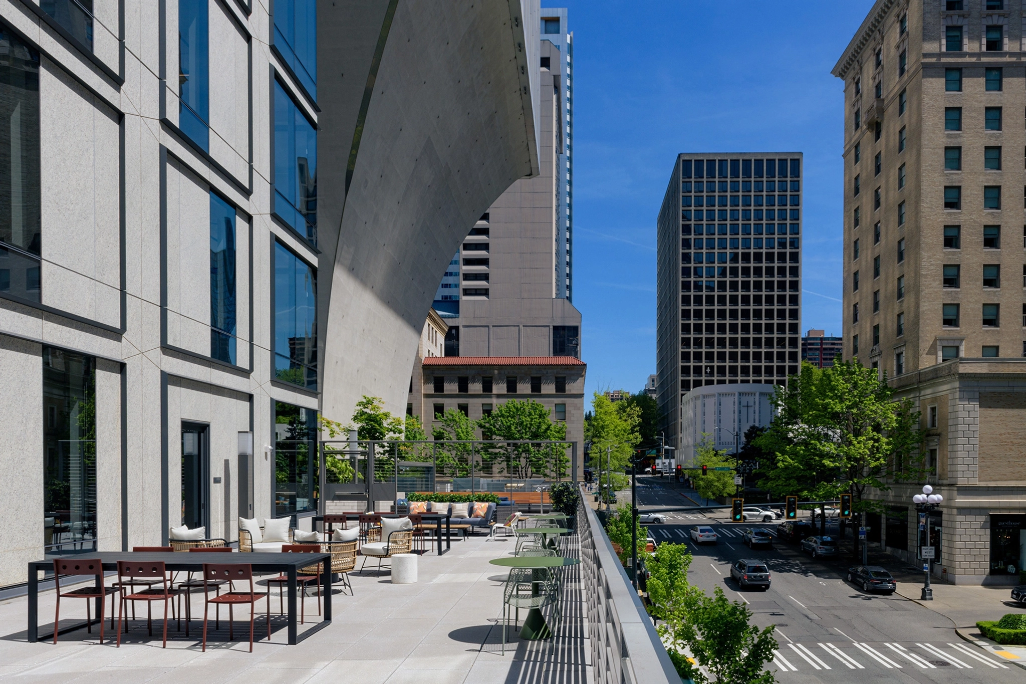 a coworking office with a balcony overlooking a city street.