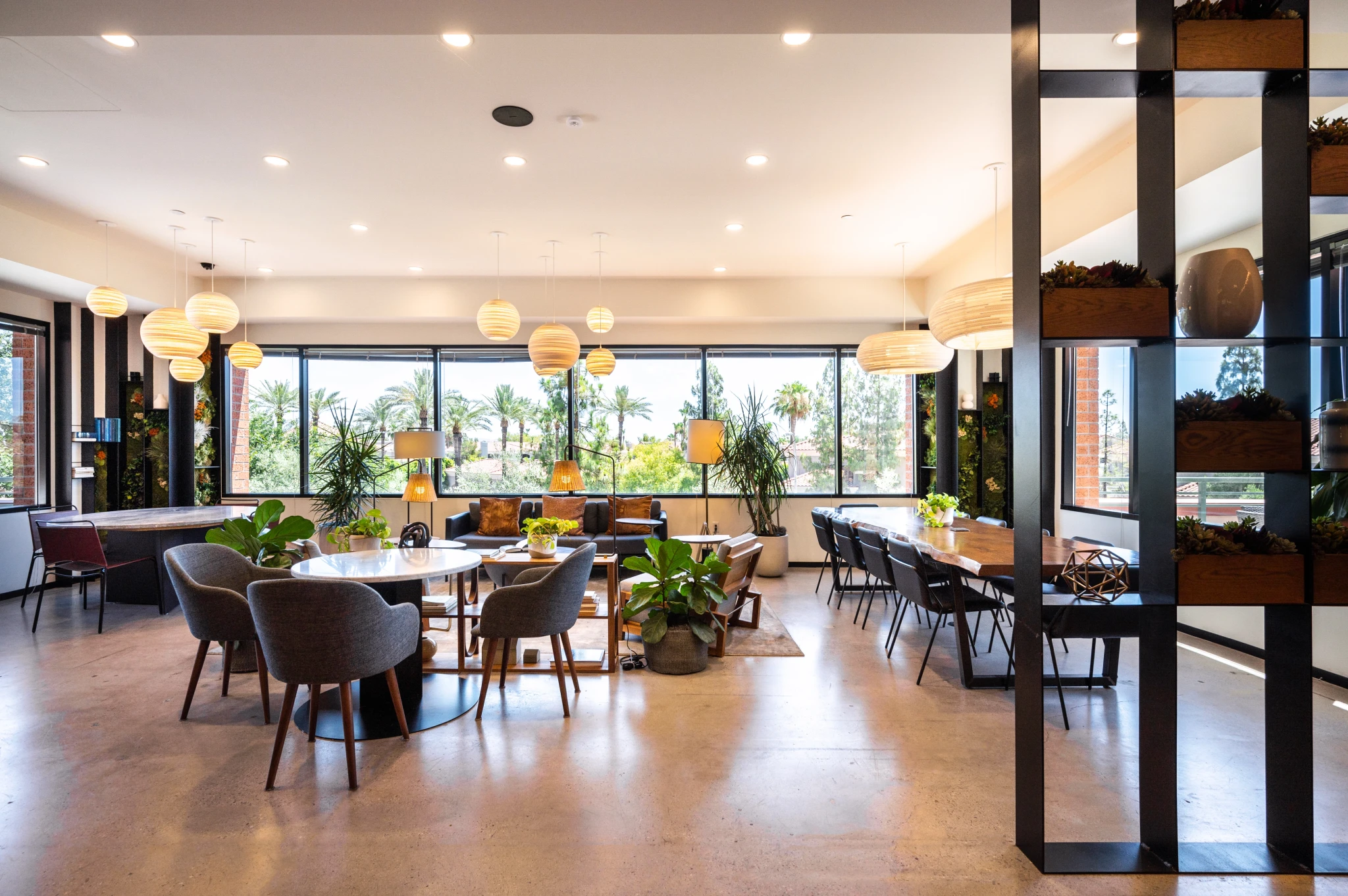 a coworking space with a large table and chairs.