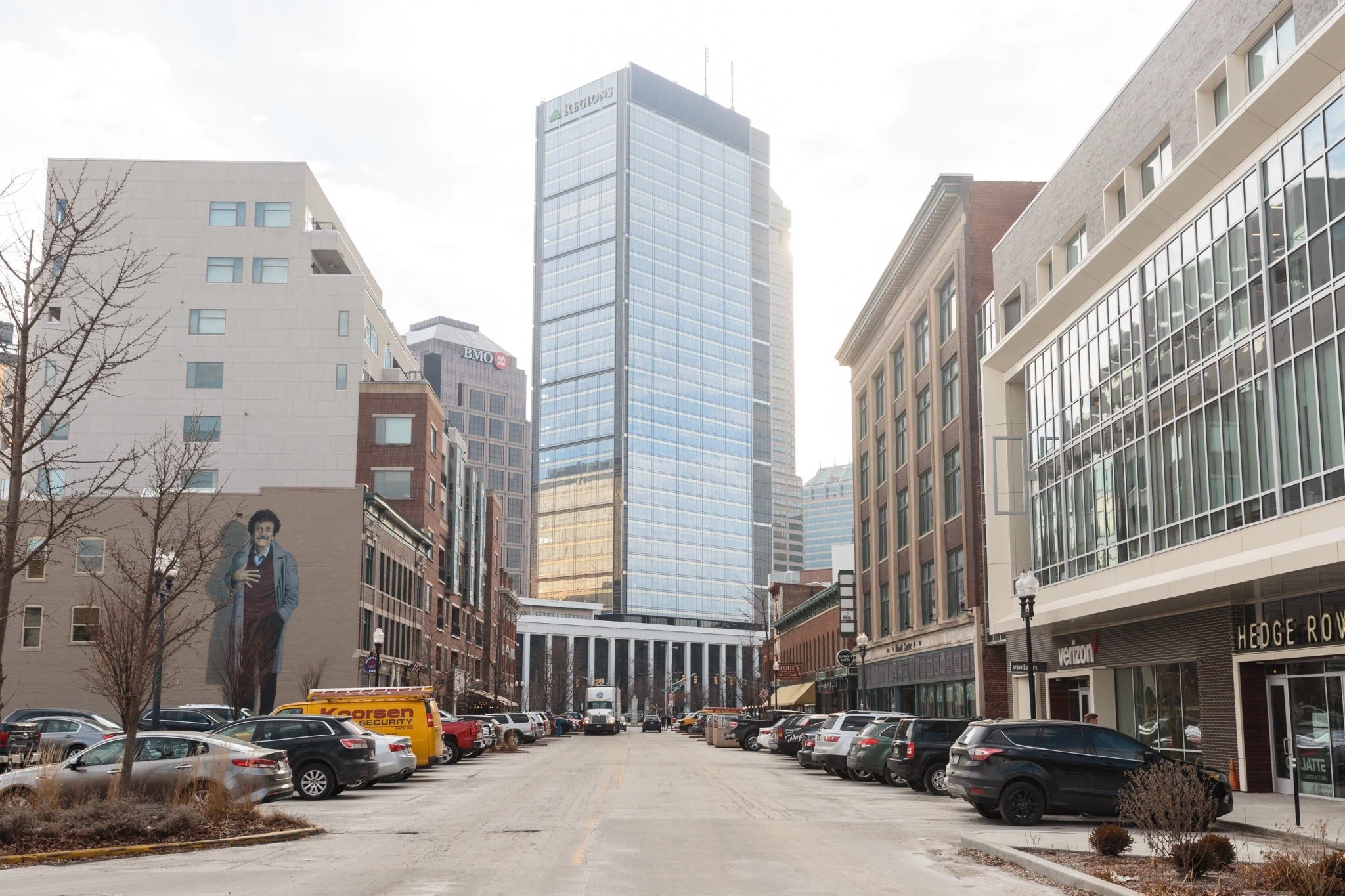 An exterior view of Indianapolis with cars parked on the street.