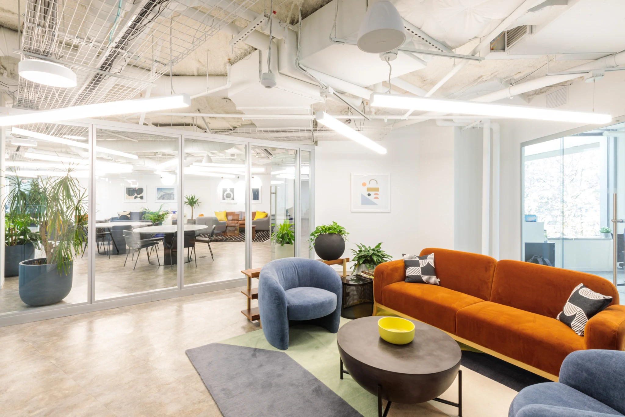 Arlington coworking space with orange couches and a coffee table.