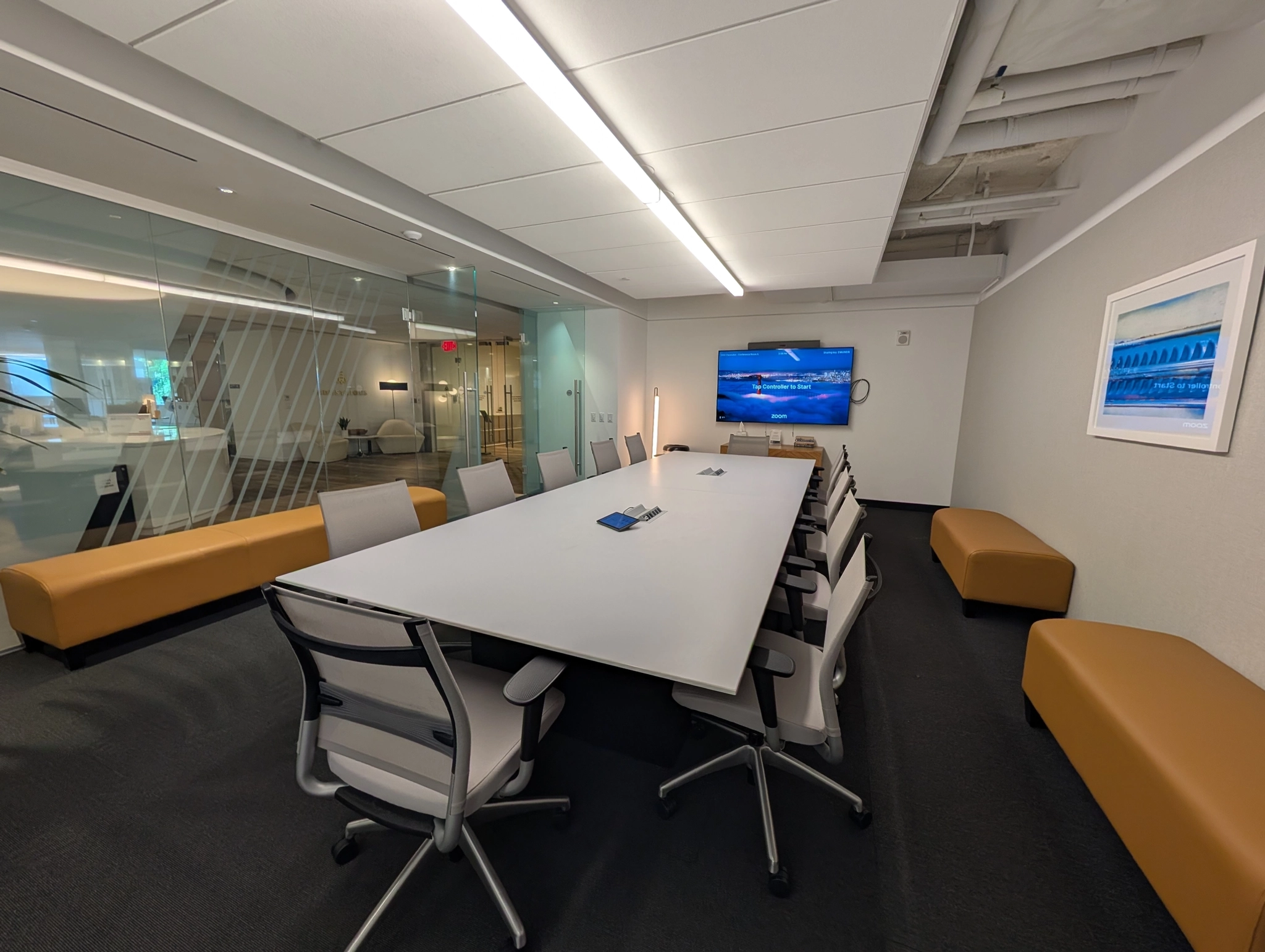a coworking space in Arlington with a long table and chairs.