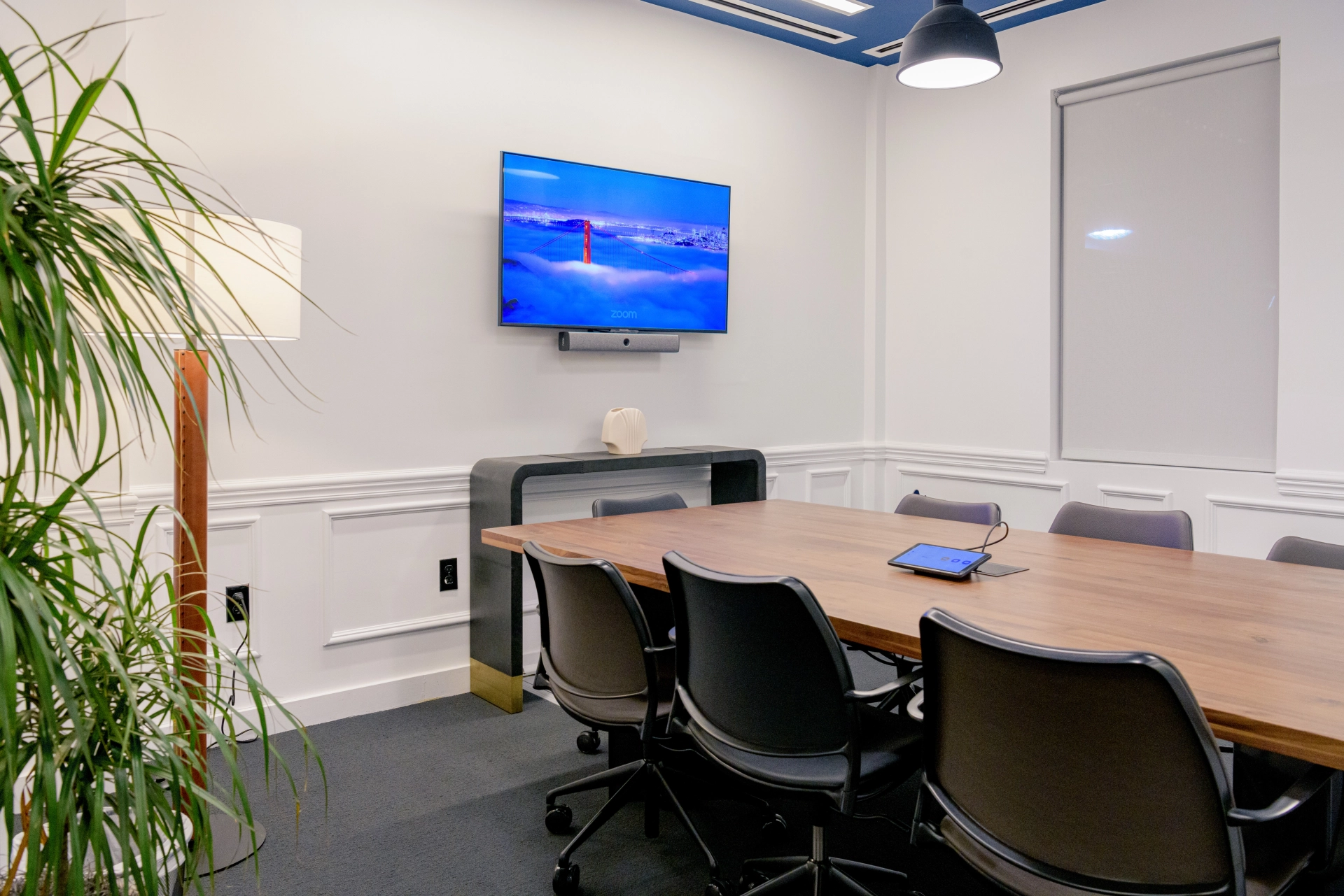 A Miami Beach meeting room with a TV on the wall.