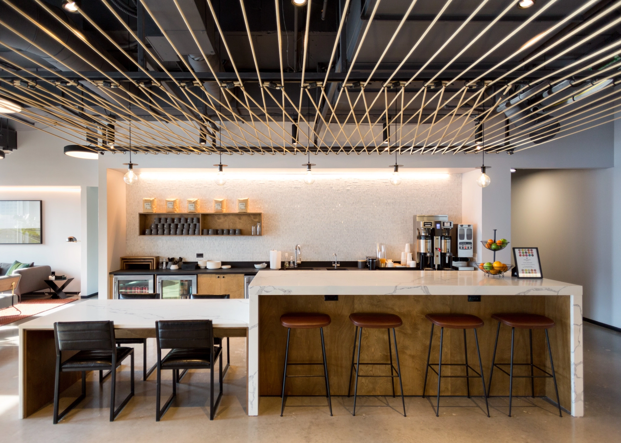 A modern Dallas office with a bar and stools.