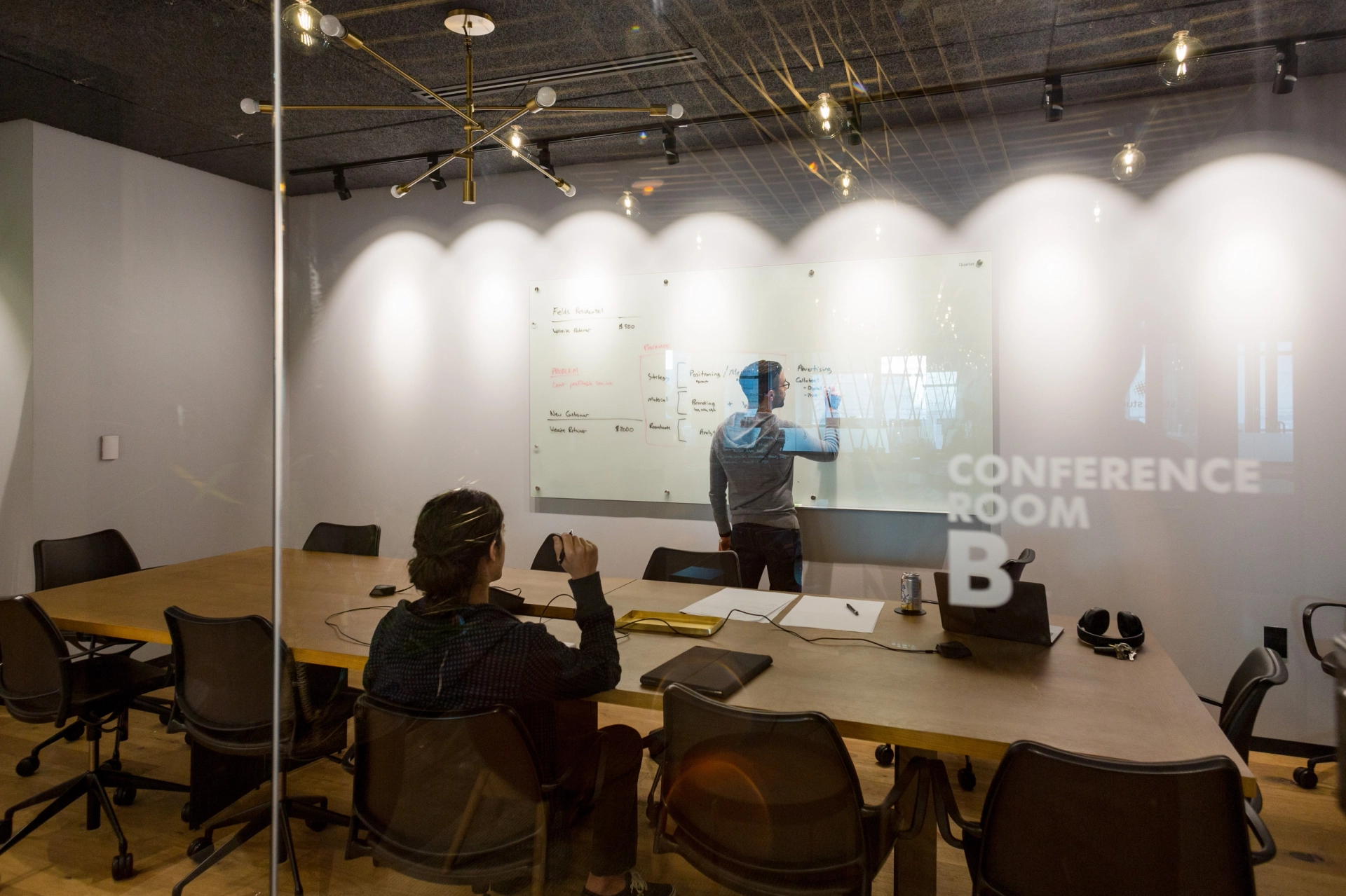 An office conference room featuring a whiteboard for collaborative workspace.